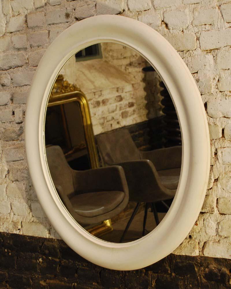 20th century French oval mirror.
Color is off white with a beautiful 100 year old patina, it still holds it's original glass.