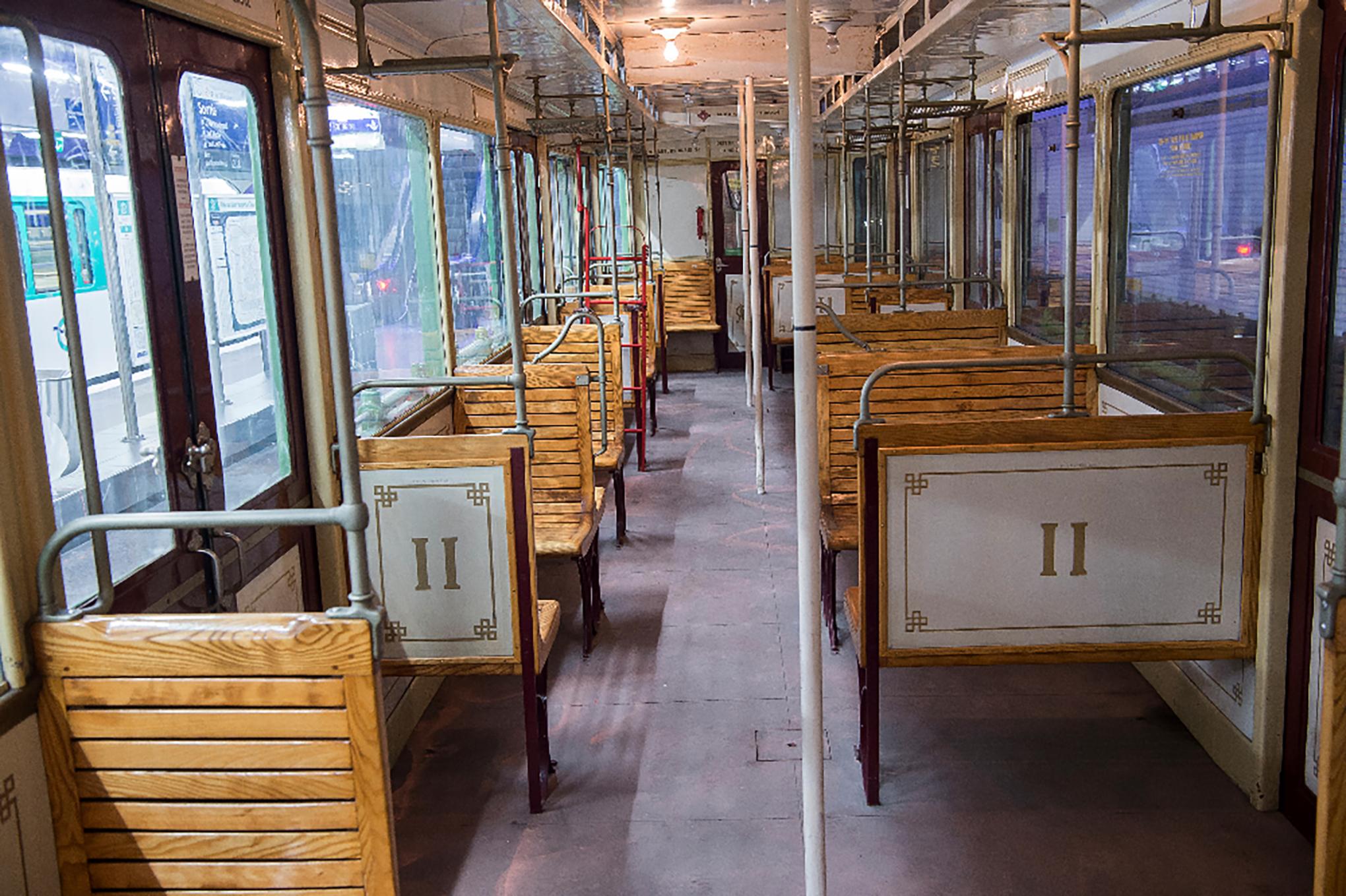 ABOUT

A pair of Paris Metro train seats with teak slats seats and a decorative metal scrolled leg. The legs are attached to a metal plate which can be removed. The back rest leans slightly forward and has a built-in porcelain enamel sign on the