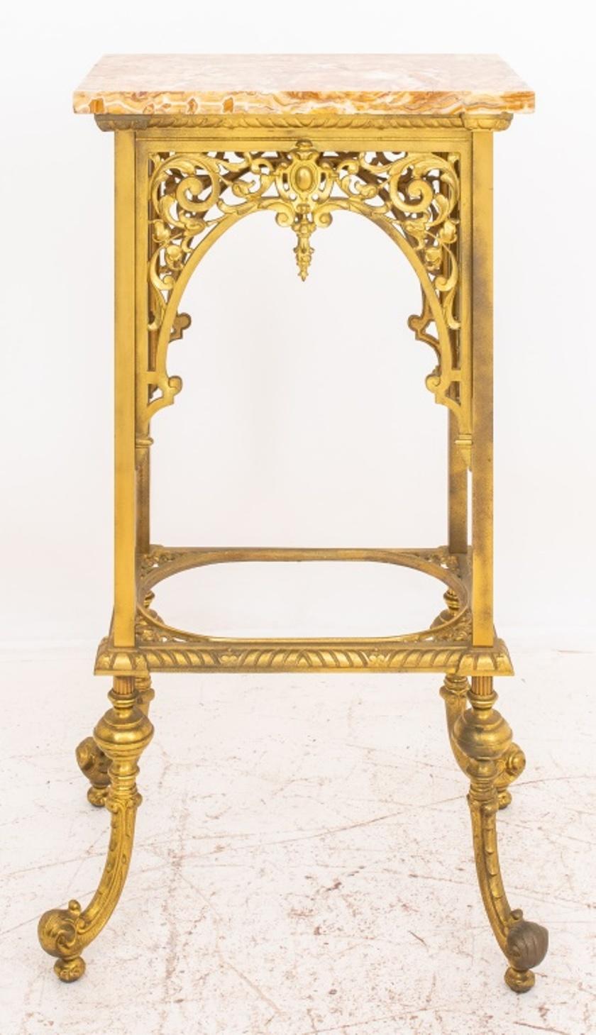 Renaissance revival marble topped brass side table or plant stand, 19/20th C., rectangular with a red onyx top, the sides with reticulated scrollwork and four splayed legs joined by a pierced entretoise with an area for a bowl or glass or marble