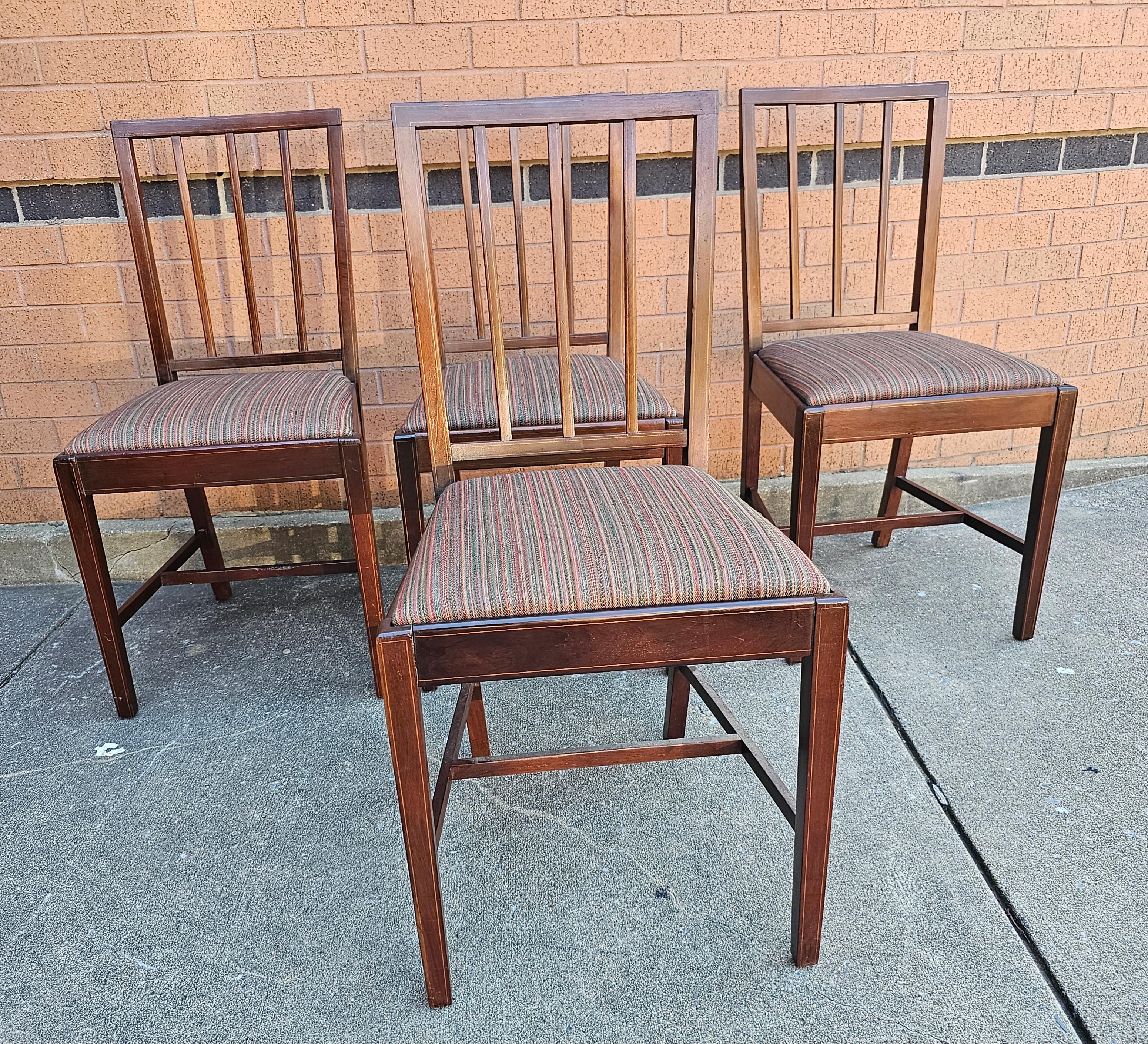 Early 20th Century Set of Four Federal Style Satinwood Inlaid Mahogany upholstered seat Side Chairs. Chairs appear to have been refinished down the road. Measure 18