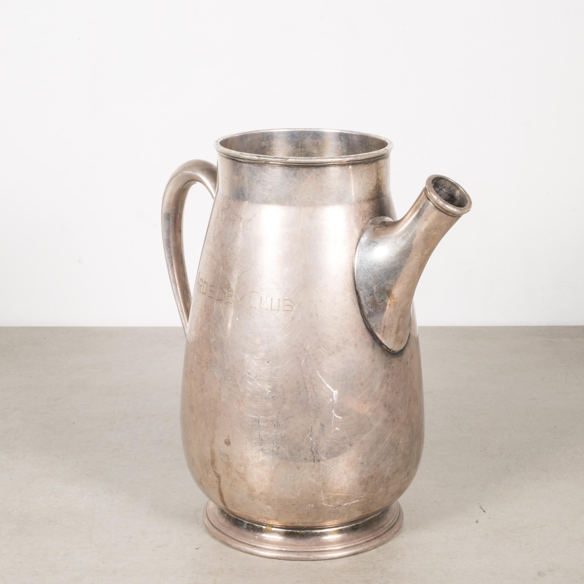 About:

This is an original silver plated pitcher trophy with 