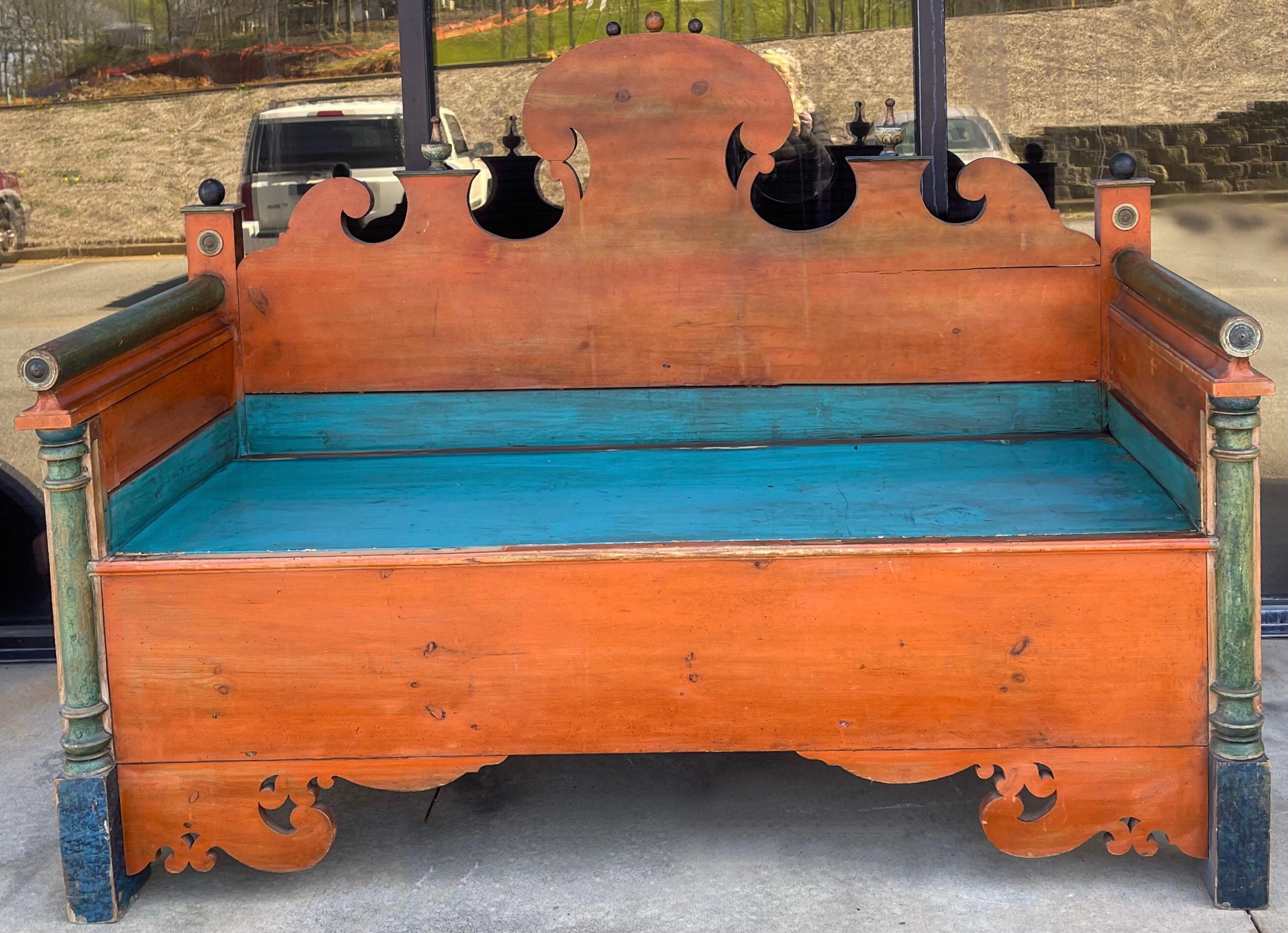 This is an early hand painted Swedish bench with seat storage. It is perfect for that large hall or garage entrance or even porch. The seat board lifts out and it is knotty pine. It definitely has been modified over the years with seating