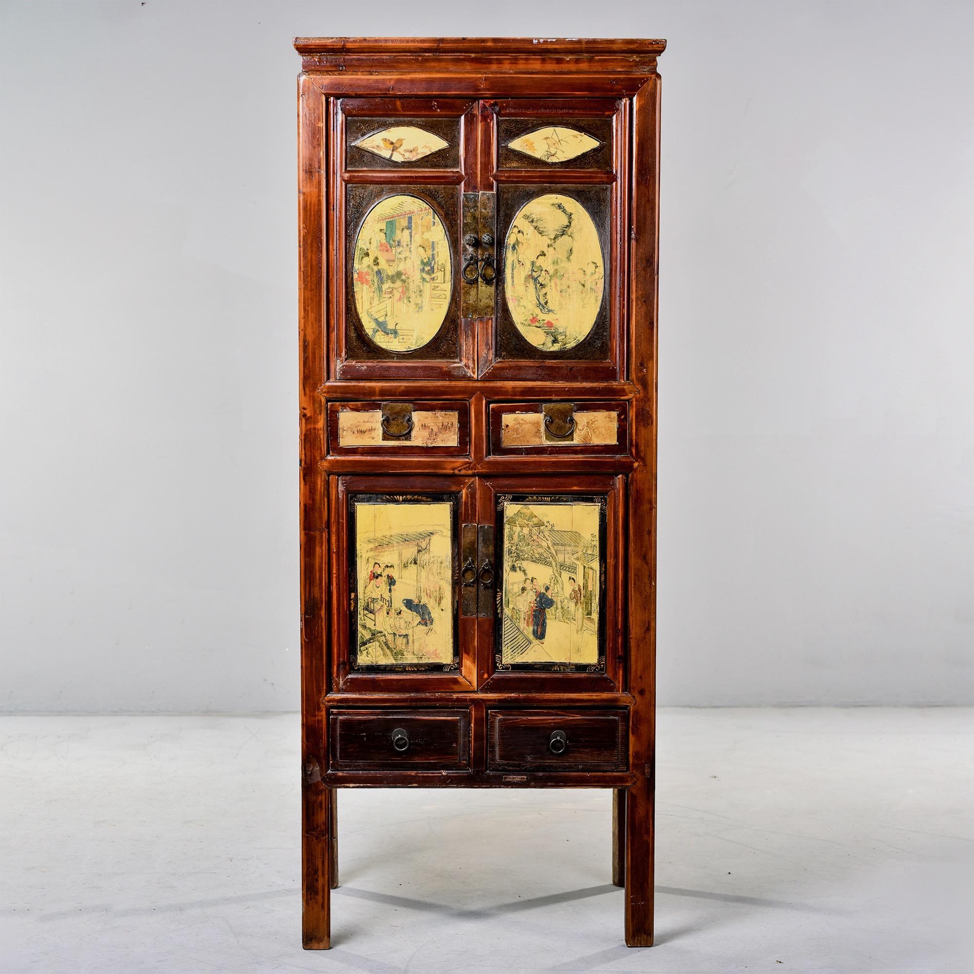 Circa 1910 tall Chinese cabinet features a top two door cabinet with a single internal shelf over two small drawers. The lower cabinet has two doors over two small drawers as well. Mortis and tenon construction. We were told by the dealer we