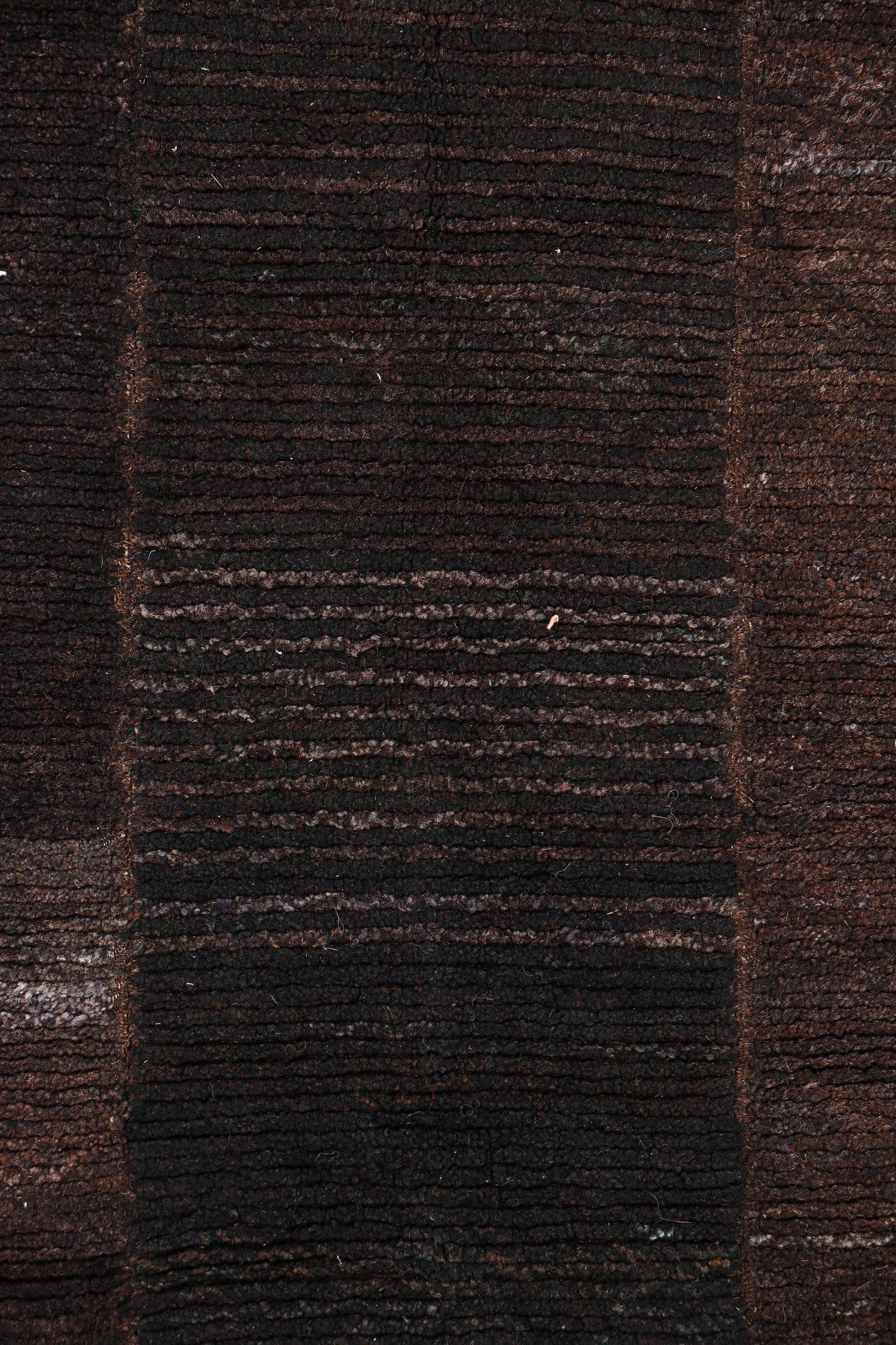 Tsuk truk rug, Tibet, early 20th C., Measures: 2'8'' x 5'2'' (81 x 157 cm). Wool. Red/orange border on chocolate brown.
