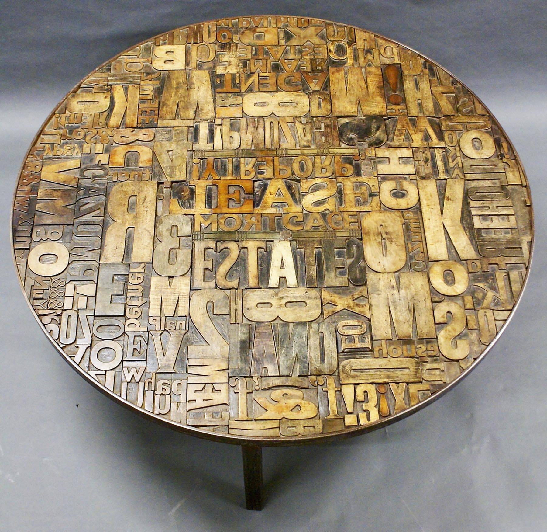 This unusual and highly decorative early 20th century coffee table is comprised of a random range of 19th century wooden printer’s blocks spelling out a range of words relating to property and sales. Leased, land and gazump are some of many terms