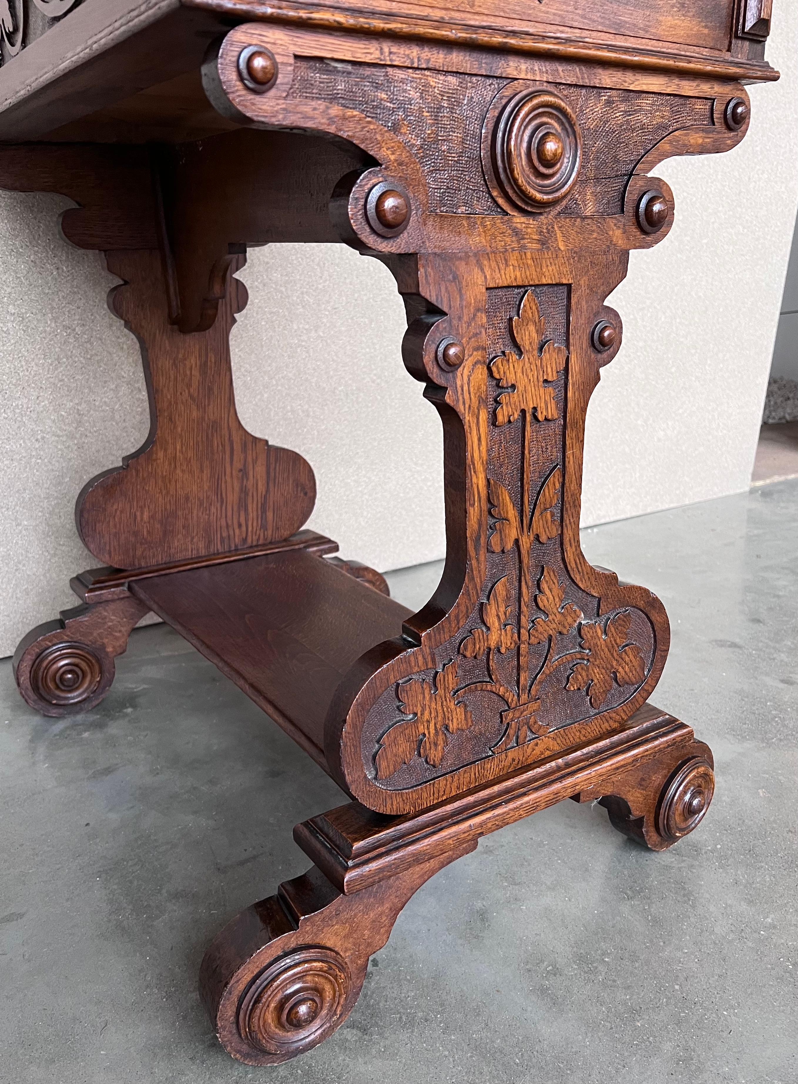 Spanish Colonial Early 20th Carved Walnut Side Table or Cart  with Drawers and Wheels For Sale