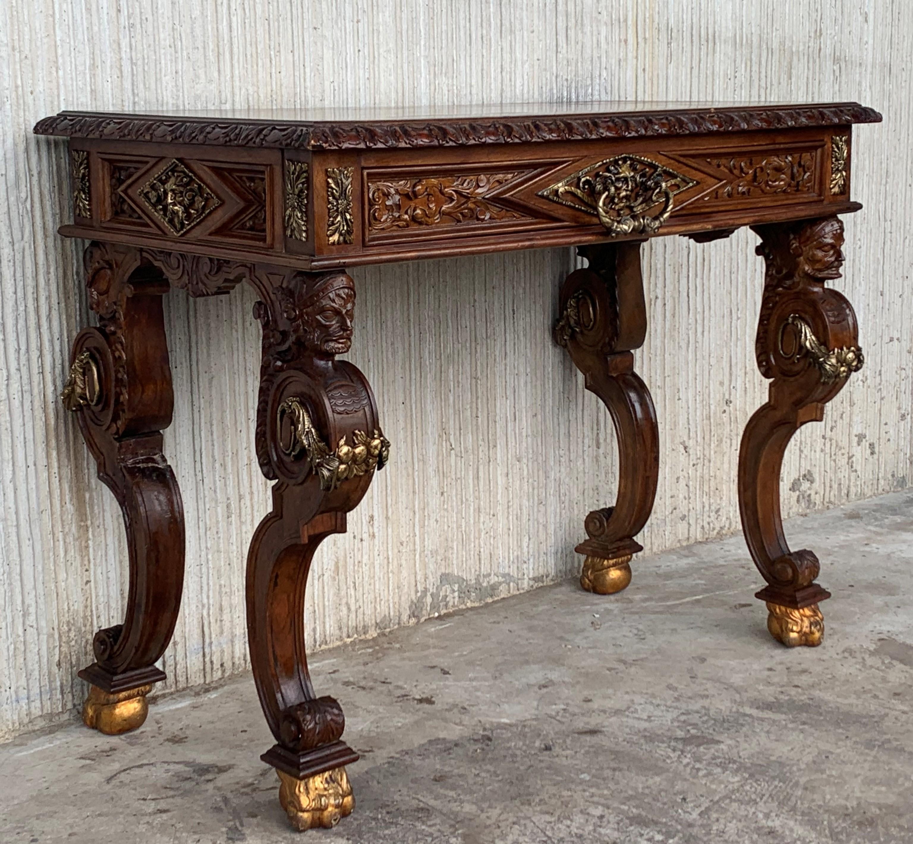 19th century Spanish Renaissance walnut writing table is a splendid example of the breed, with classical architecture enhanced by hand carved relief work in an abstract expression of the Renaissance style. Four carved columns depicting Sirs form the