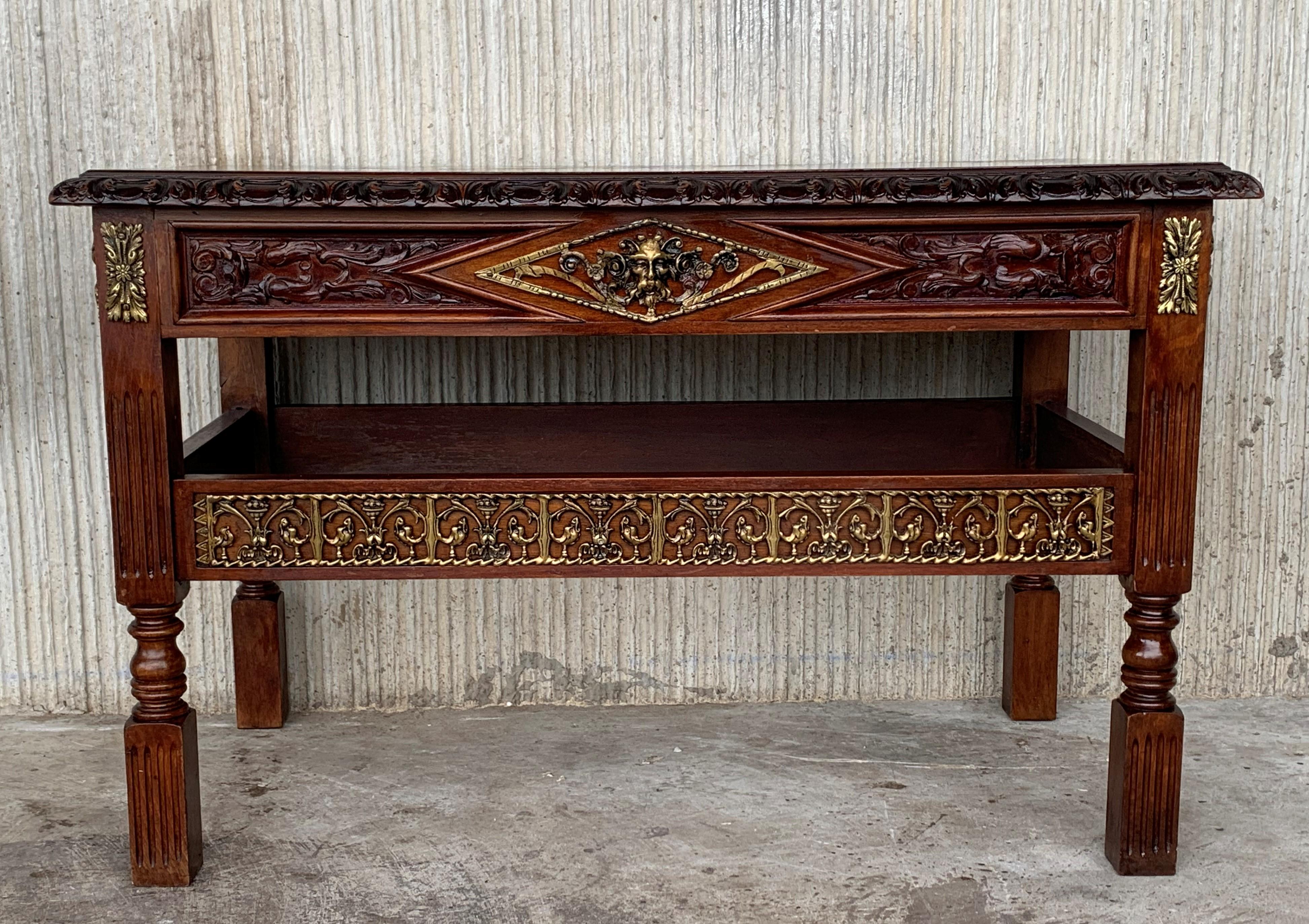 19th century Spanish Renaissance walnut writing table is a splendid example of the breed, with classical architecture enhanced by hand carved relief work in an abstract expression of the Renaissance style. Four carved fluted columns the main legs.