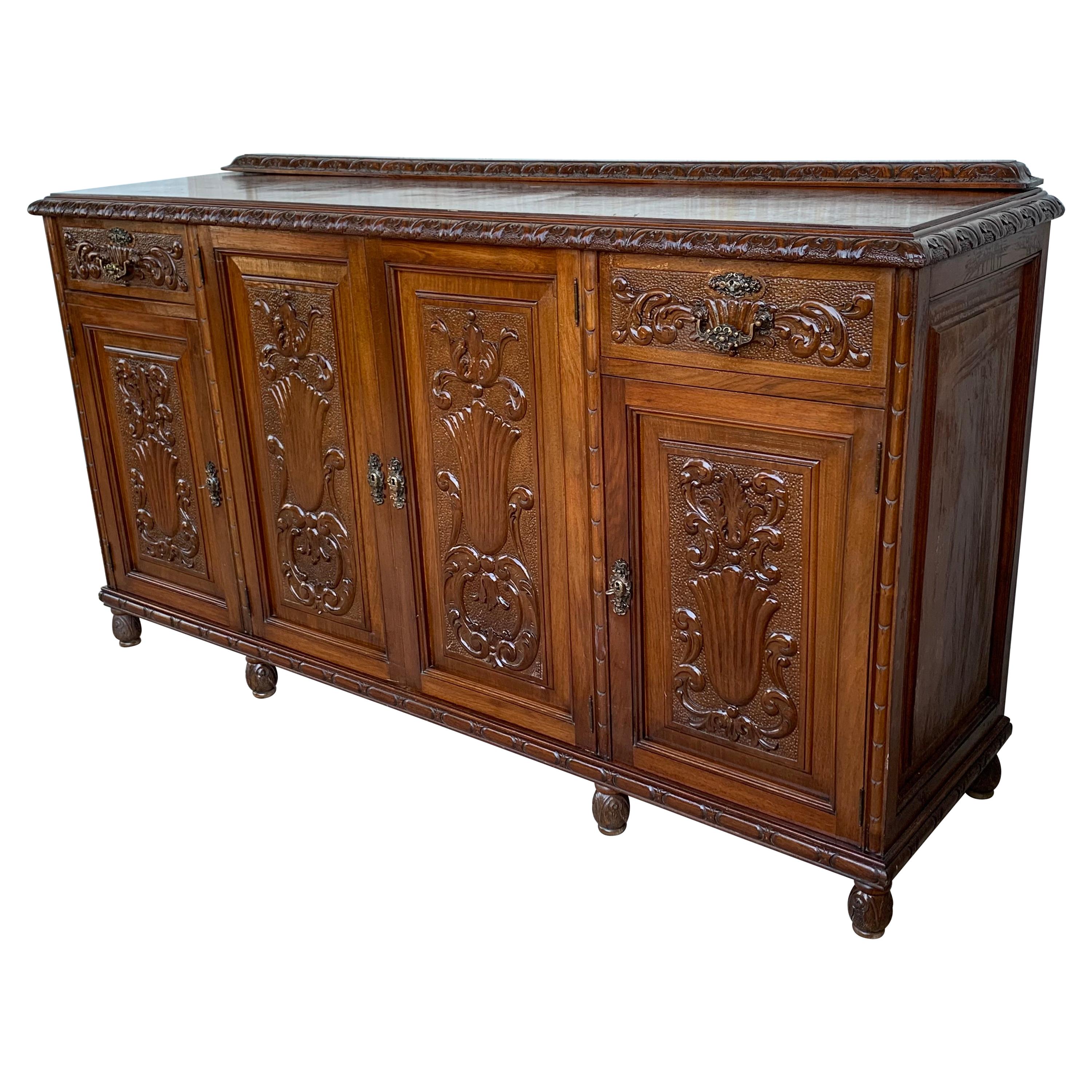 Early 20th Carved Walnut Sideboard with Four Doors and Two Drawers and Crest For Sale