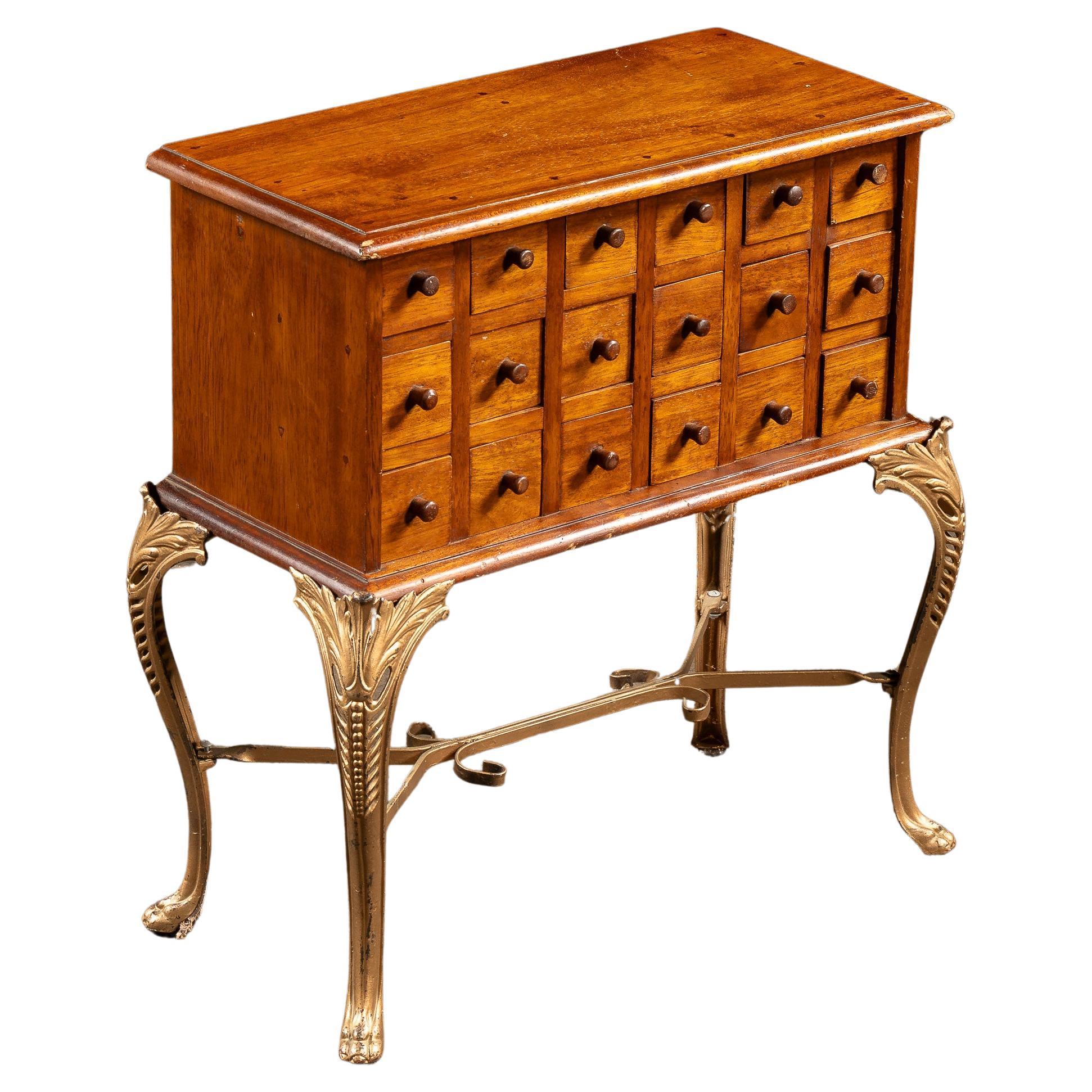 Early 20th Century 18-Drawer Apothecary Cabinet on Cabriole Brass Stand For Sale