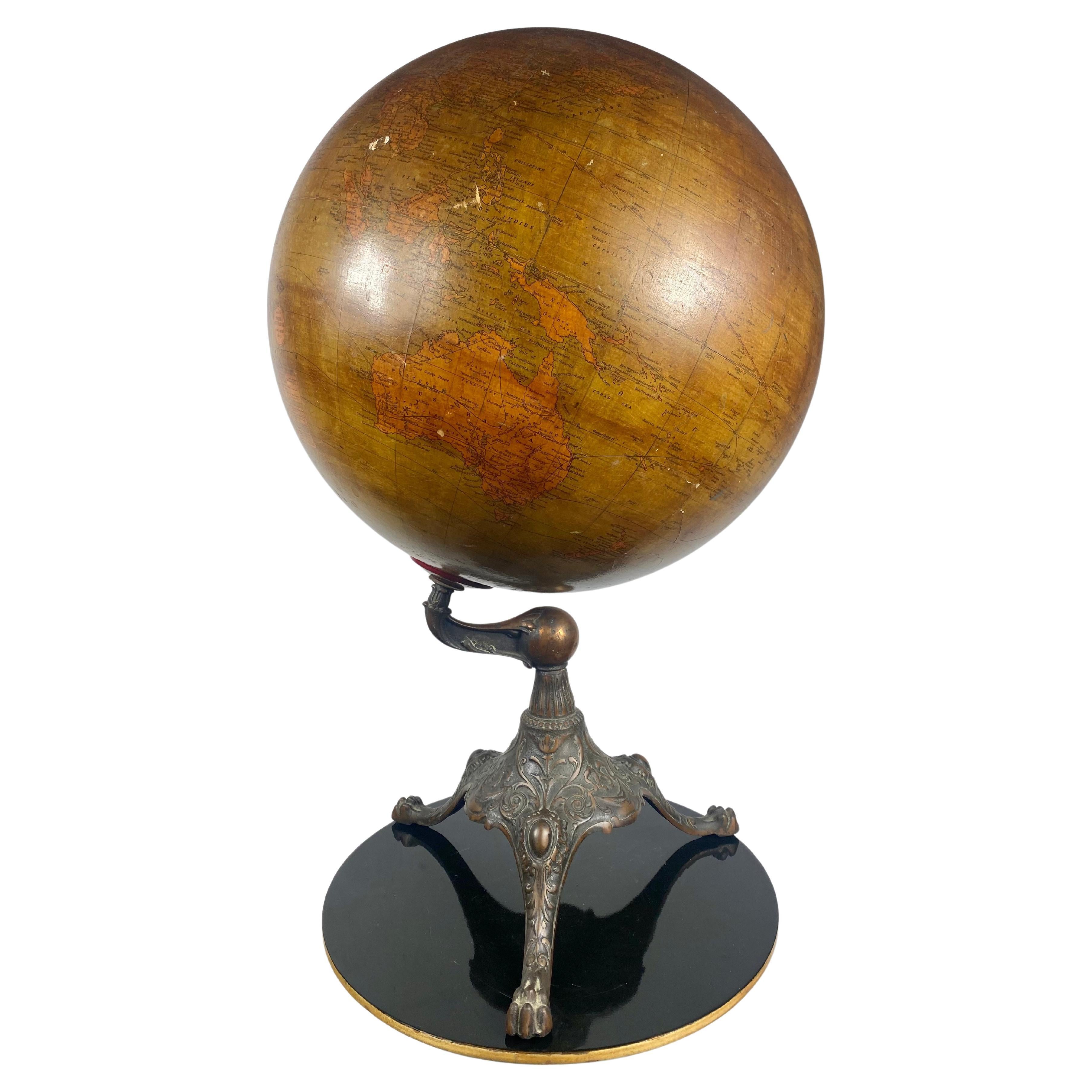 Early 20th Century Globe by Weber Costello Co. Ornate Cast Iron Base For Sale