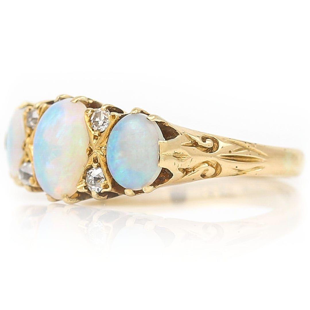 Oval Cut Early 20th Century 18ct Gold Opal and Diamond Seven Stone Ring Circa 1910