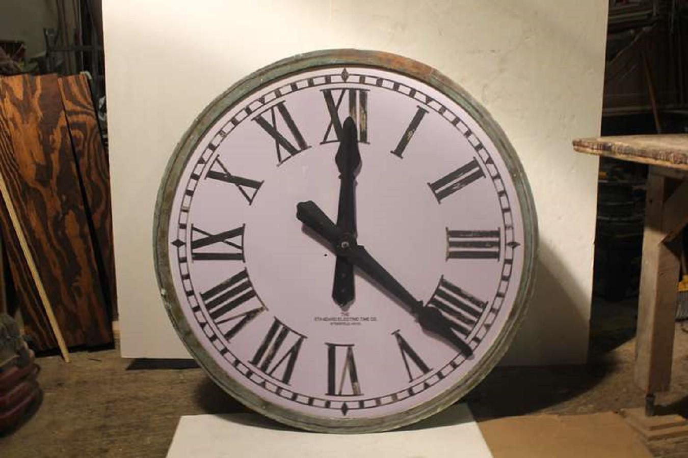 Original American 1900's over sized tower light up clock with milk etched glass face and copper frame.