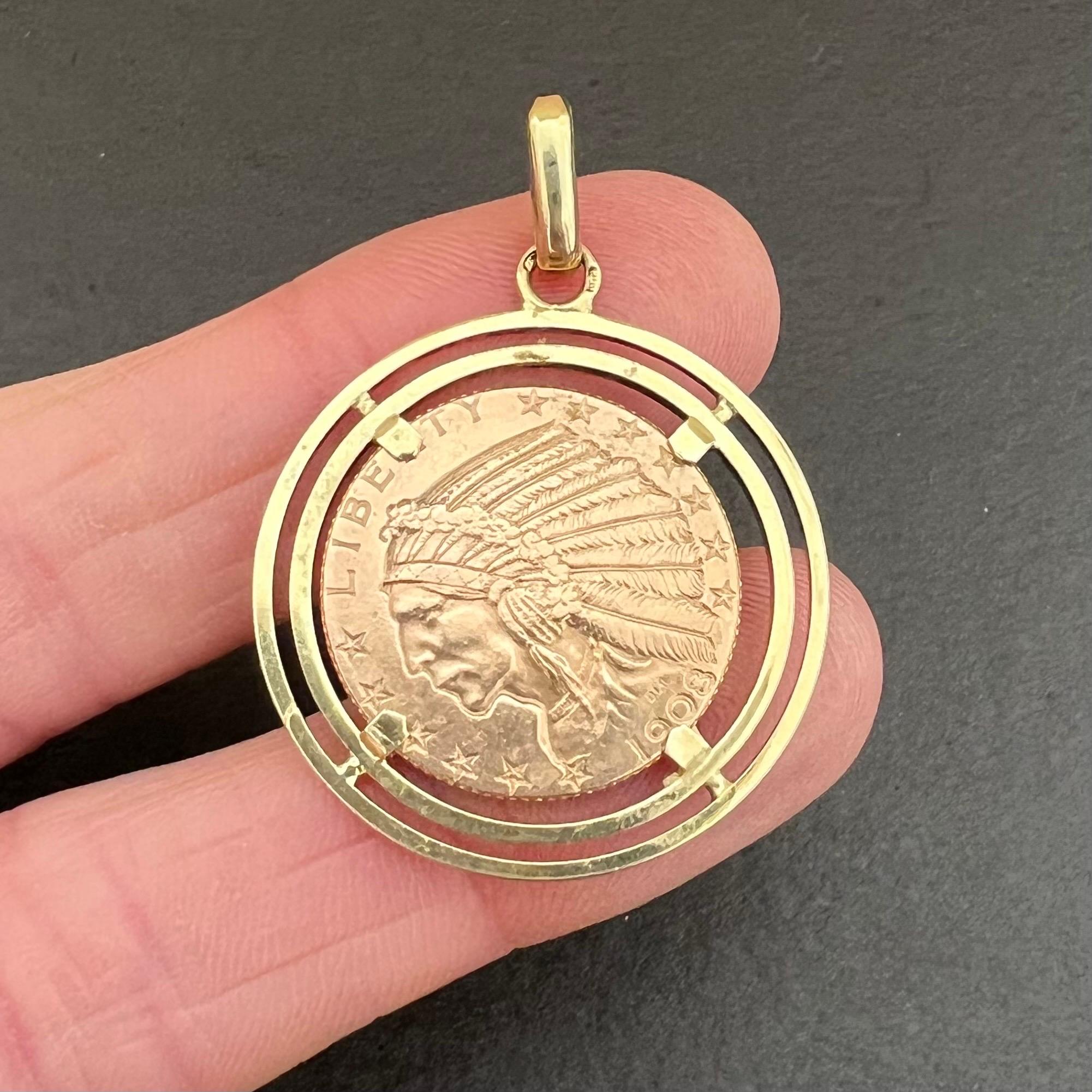 A 1908 five dollar coin charm pendant. The coin consists of 21.6 karat gold and the pendant is made of 14 karat gold. On the reverse the obverse bears the portrait of an Indian chief with formal headdress, with the words LIBERTY at the top and the