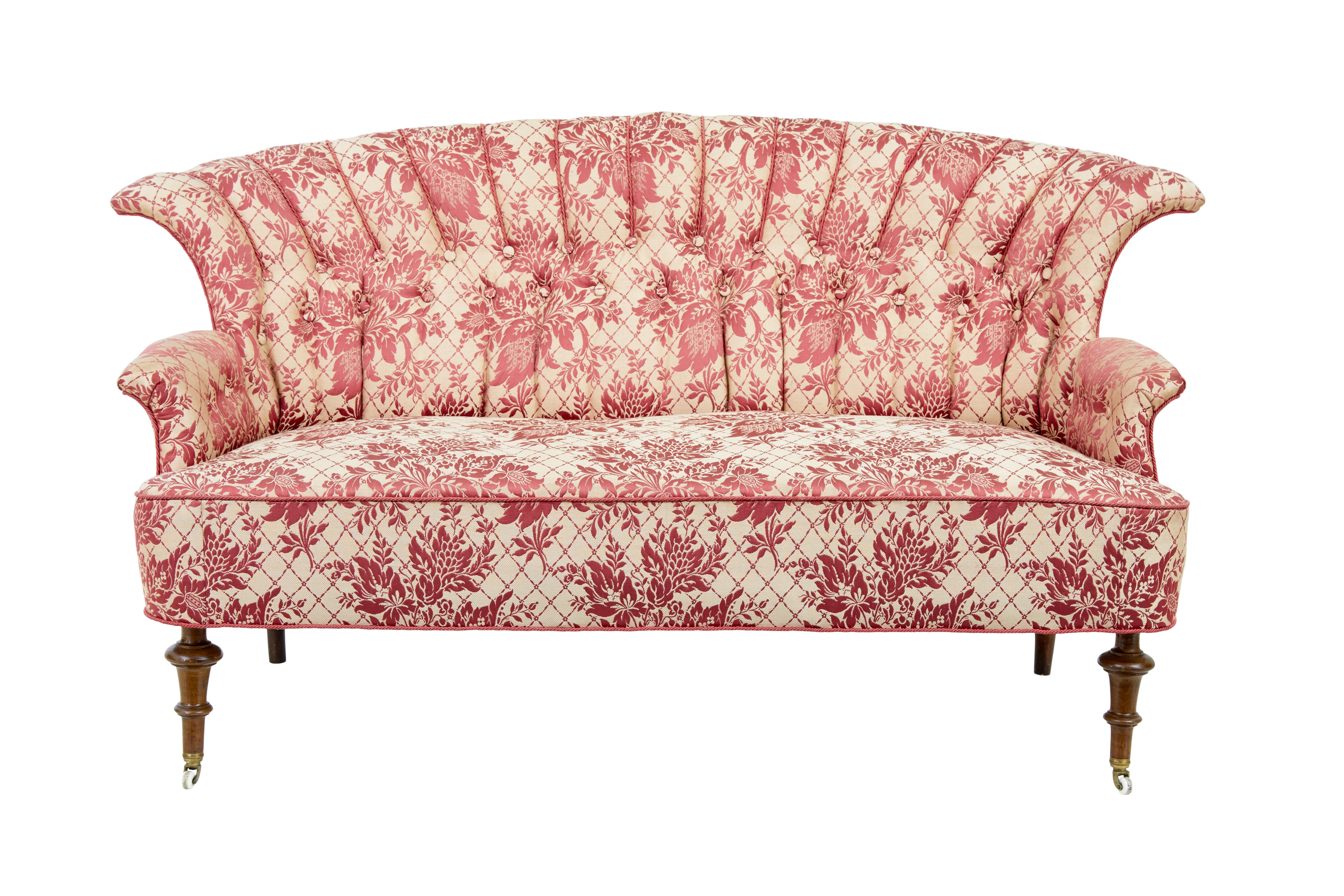 Striking 3 piece salon suite circa 1900.

Suite comprises of a sofa and 2 matching chairs.  Each with fan shell backs, piping and button back detail.  Richly upholstered in later cream material with red silk woven pattern.  Wire back