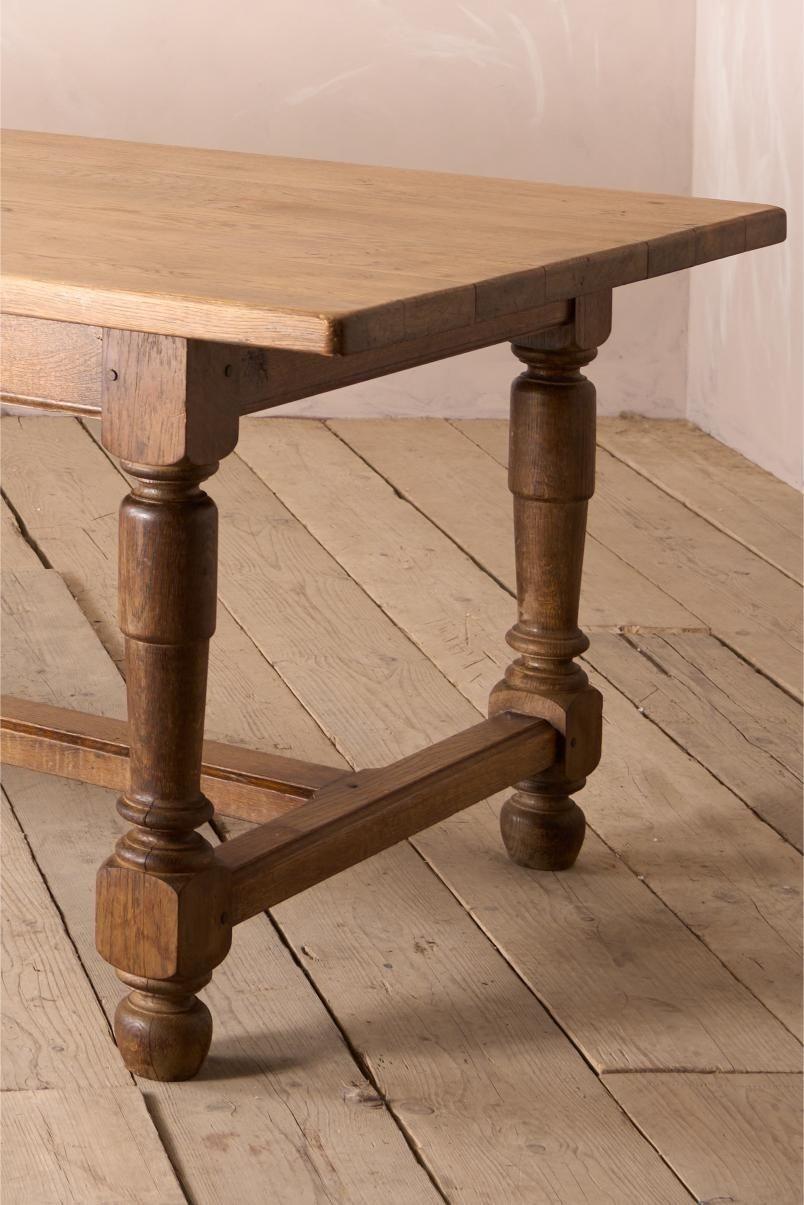 This is great looking early 20th century solid oak dining table. Stylish classic design that really will sit well anywhere and in great overall condition. Nice aged patina to the top and the base but very clean overall. Solid oak so it really will