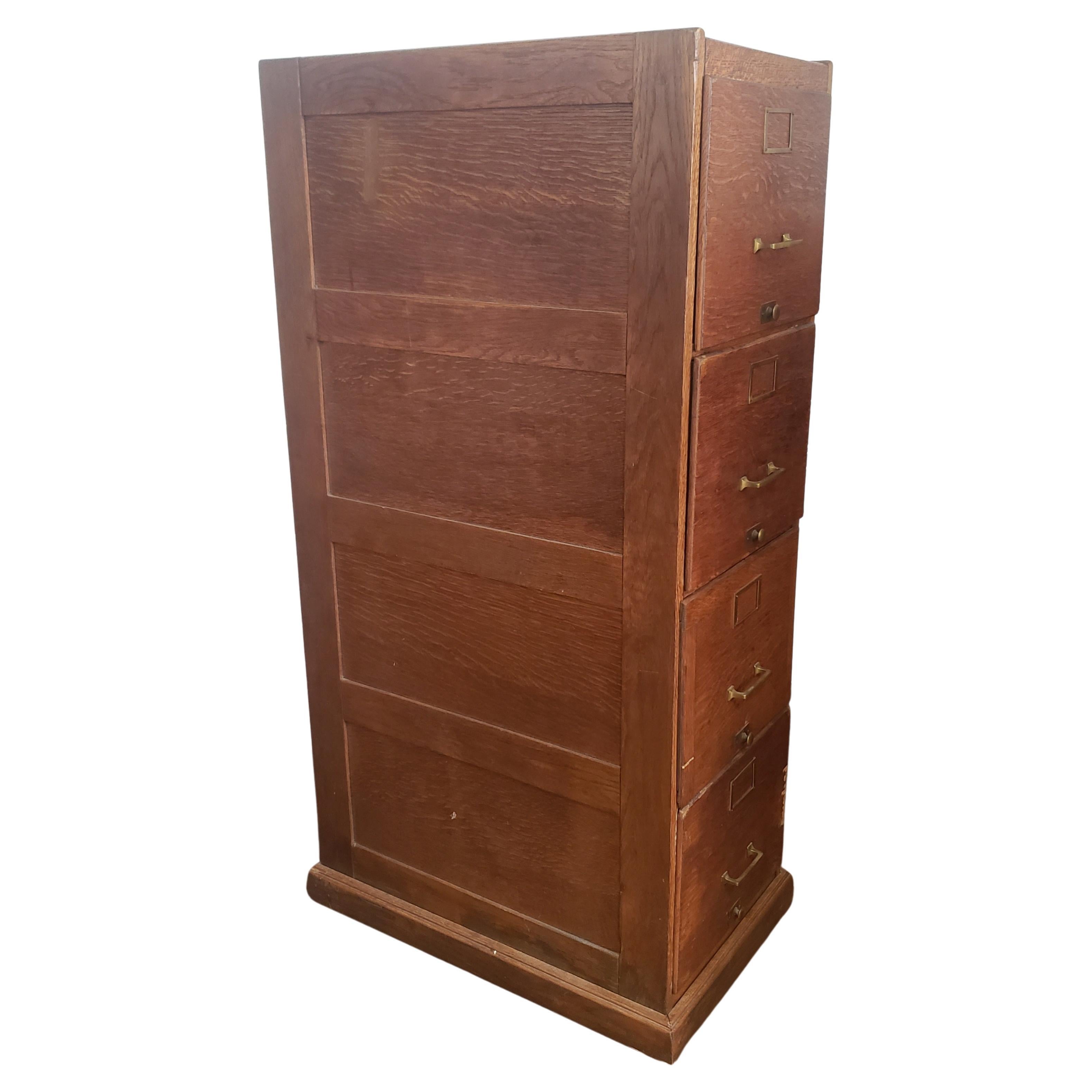 1920s oak panelized four drawer file cabinet. Heavy duty. Had been refinished and looks great with age patina.
All drawers working smoothly. Deep enough for both legal and letter size file folders. Will make a statement piece in your