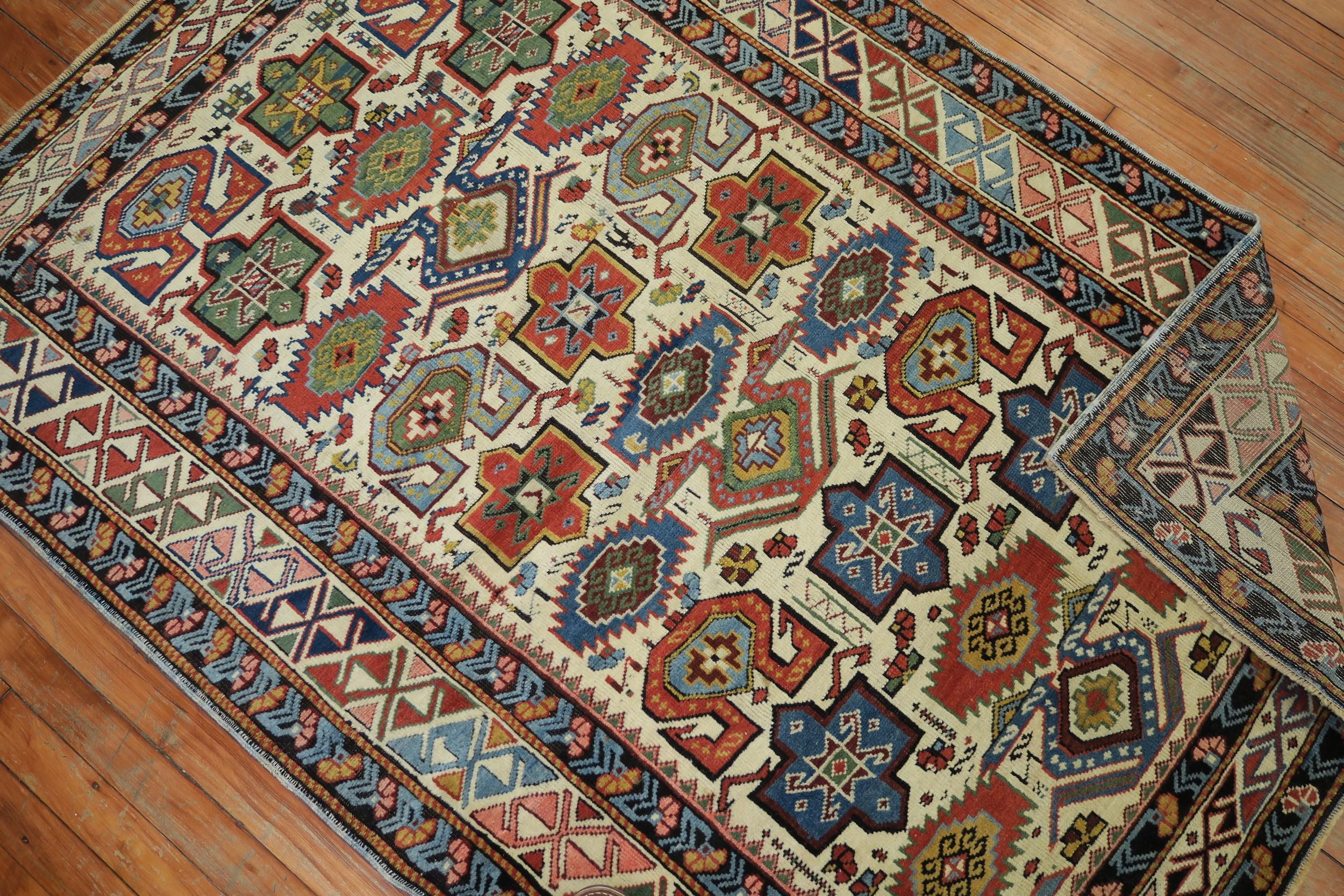 Early 20th Century Ivory Field Antique Caucasian Kuba Rug In Excellent Condition In New York, NY