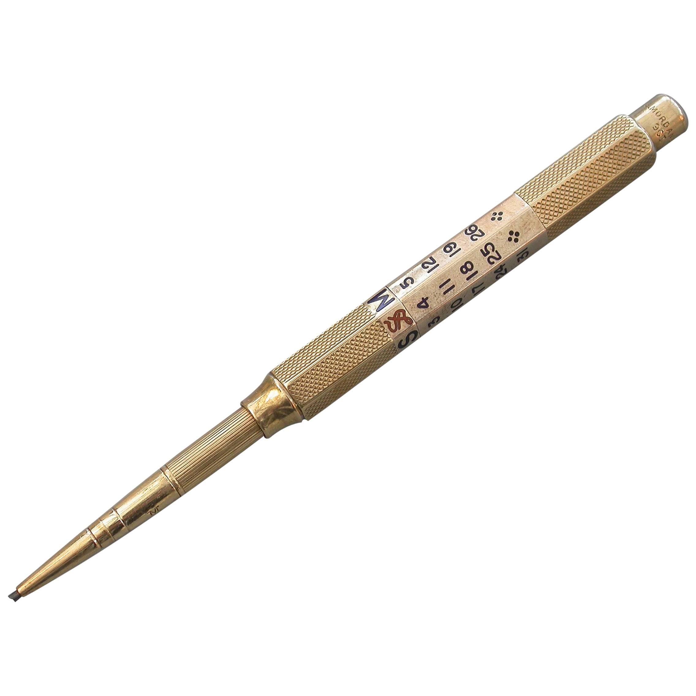 A good quality early 20th century 9-carat gold and enamel propelling pencil with push button 