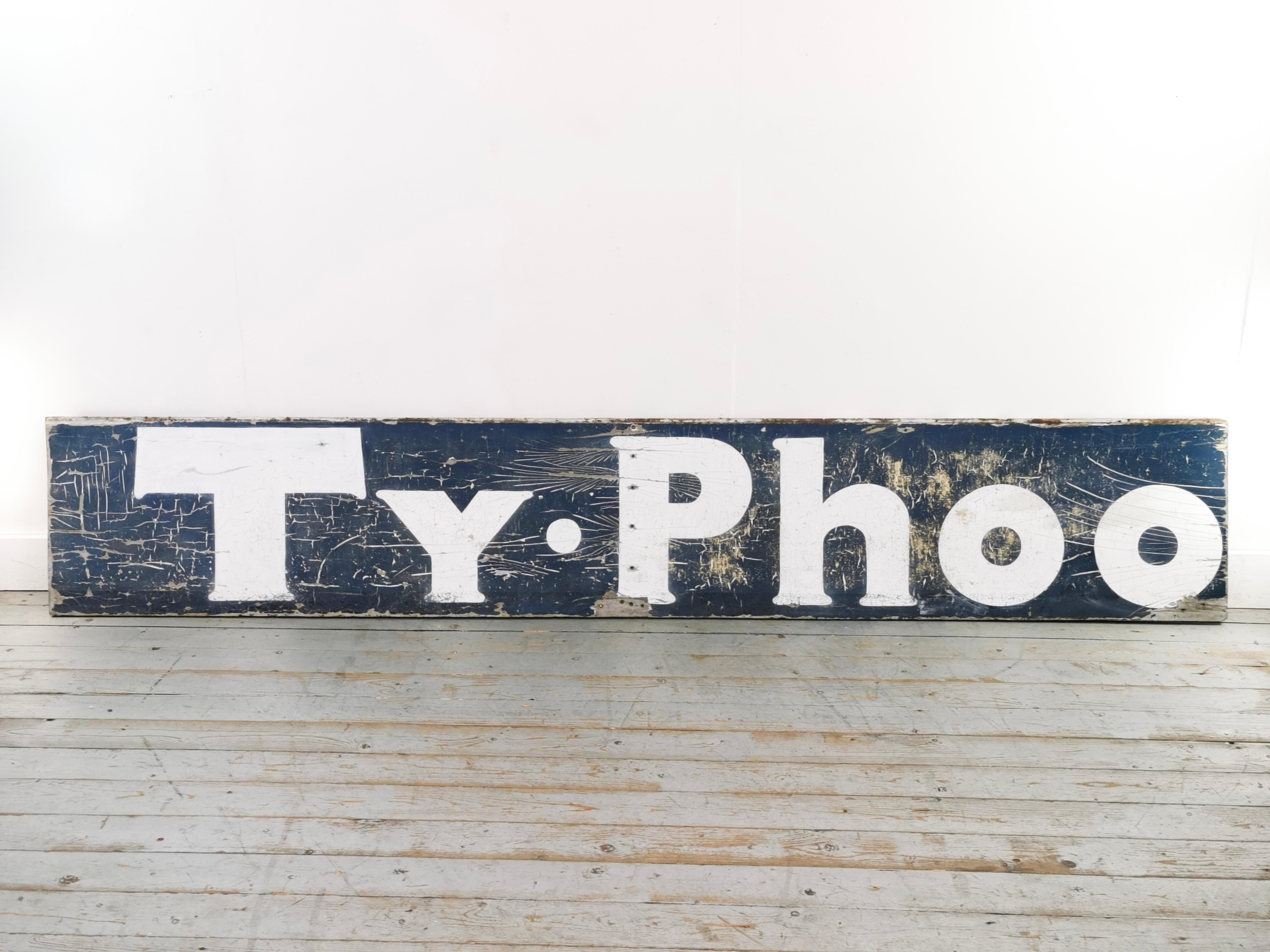Painted wooden advertising typhoo tea Sign.

An extra large 9.5-foot reclaimed solid wood advertising sign for Typhoo tea. Dates to the early 20th century.

Completely original, untouched with fixing holes and has a distressed look.