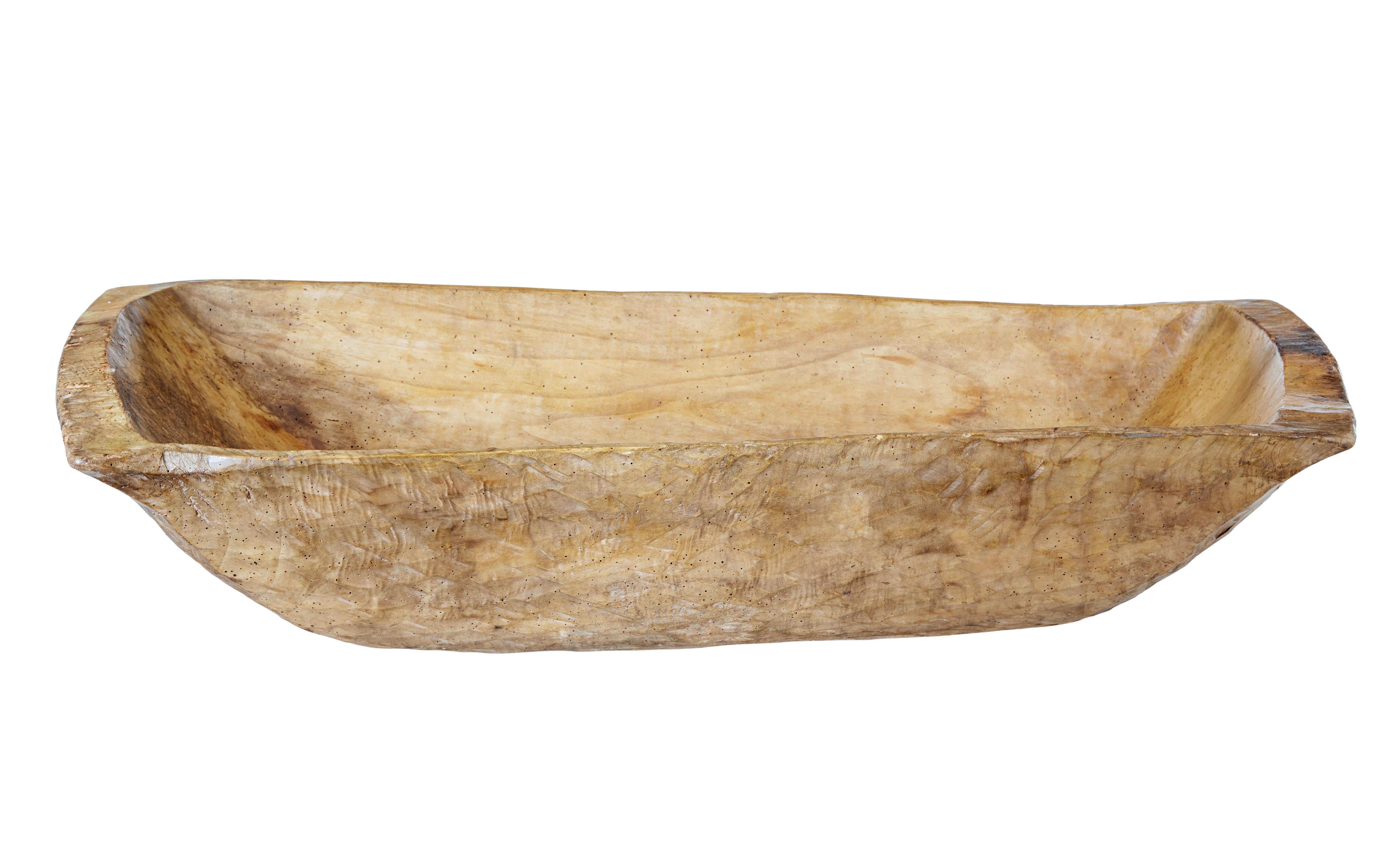 Early 20th century adzed food vessel circa 1900.

Here we have a rustic made food vessel, usually made for feeding animals in eastern Europe.  Hand carved from a solid tree trunk using an adze technique.

Our example has been fully treated and