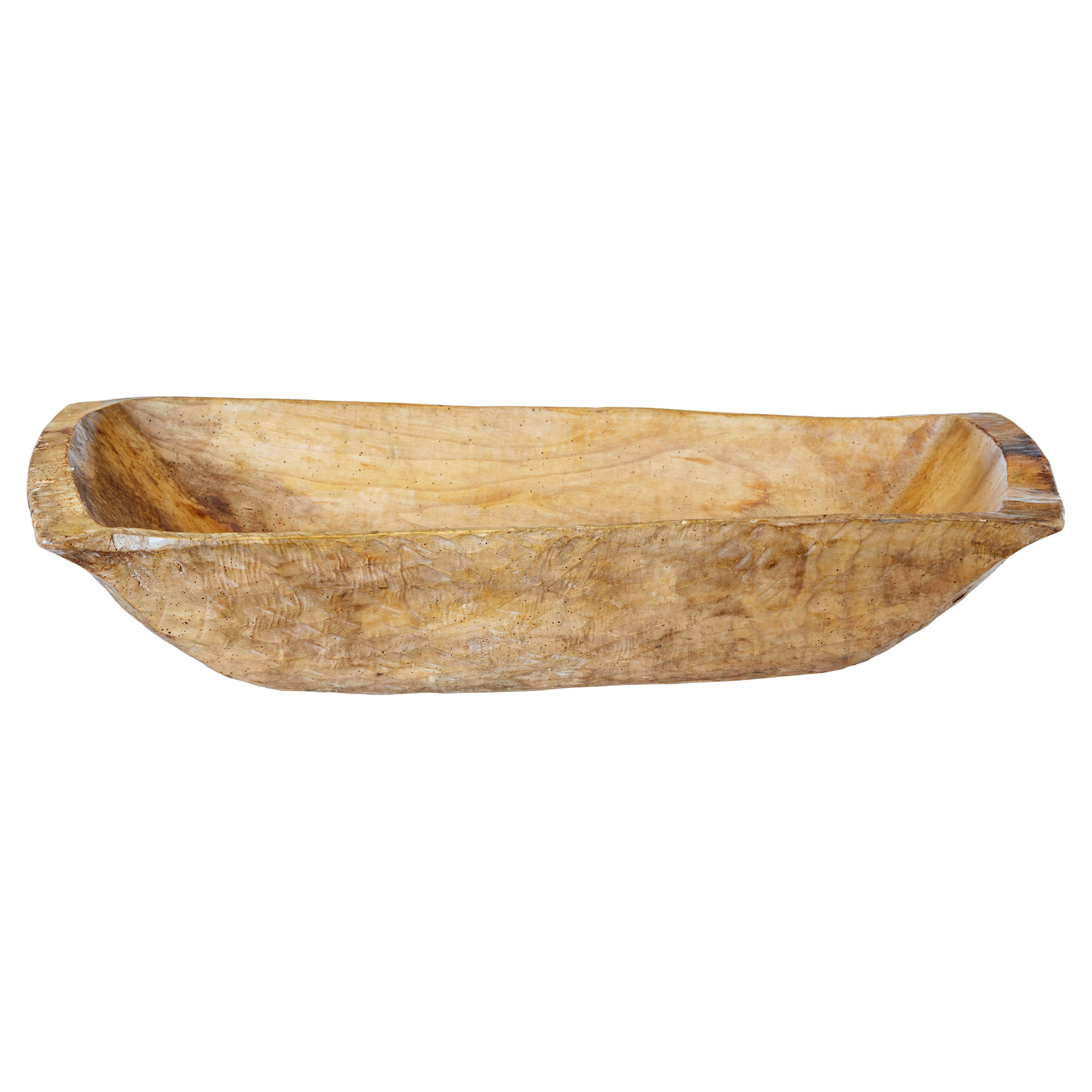 Early 20th century adzed food vessel