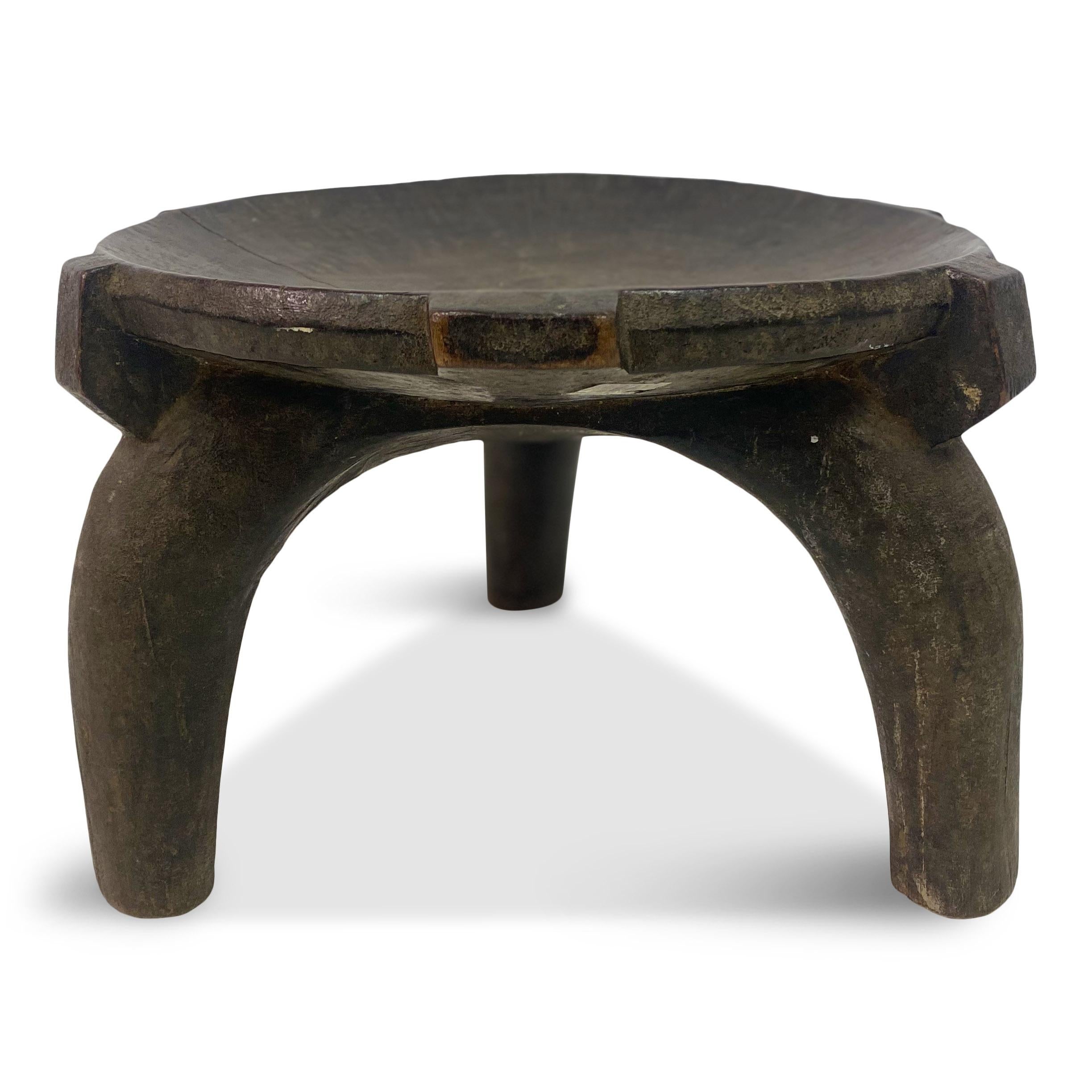African stool

Possibly Kenyan

Dished seat 

Tripod legs

Early 20th century

One photo shows the stool with a partner.