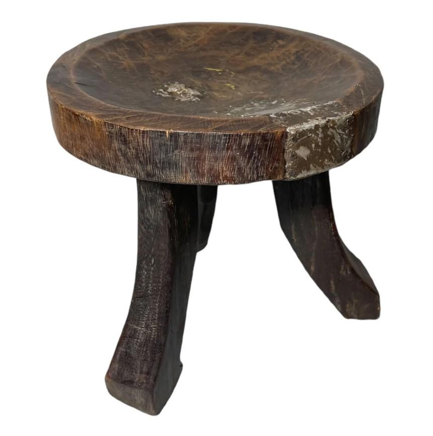 Early 20th century African wooden stool beautifully hand crafted in Southern Tanzania. Incredible patina throughout this beautiful design.