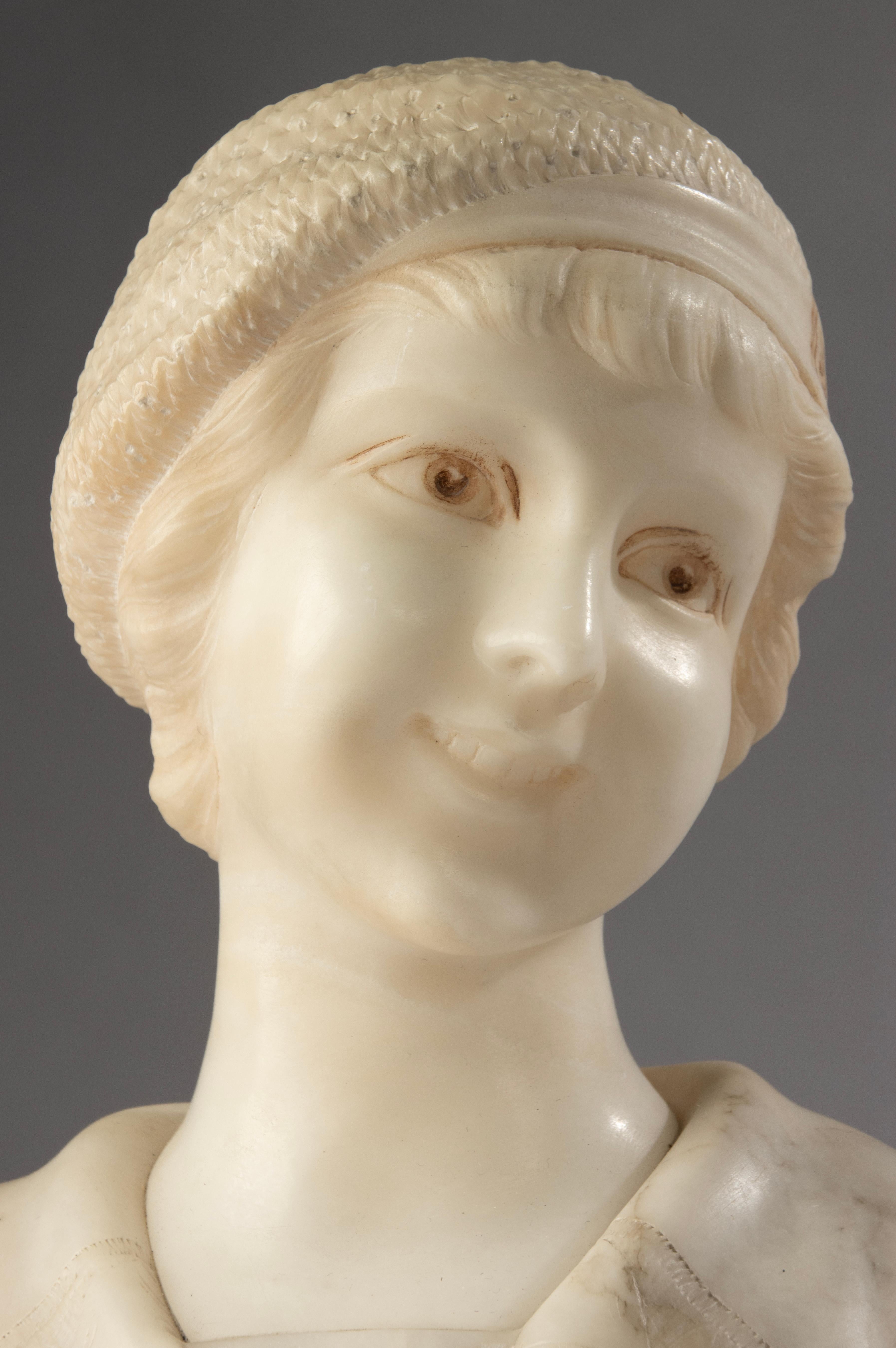 A beautifully executed alabaster bust of a young woman, crafted during the Art Deco period by renowned Italian sculptor A. Trefoloni. This charming sculpture captures the innocent grace and subtle elegance of its subject, portrayed with a gentle