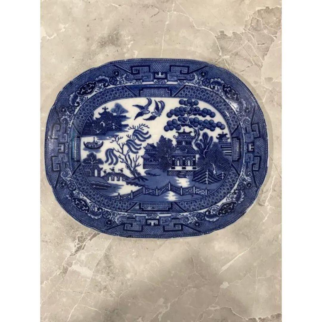 Stunning antique early 20th century English Blue Willow serving platter, made in Staffordshire! Excellent crisp blue transfer on a lovely paste porcelain platter! It would be a great addition to your dinner table or to hang on a wall for an