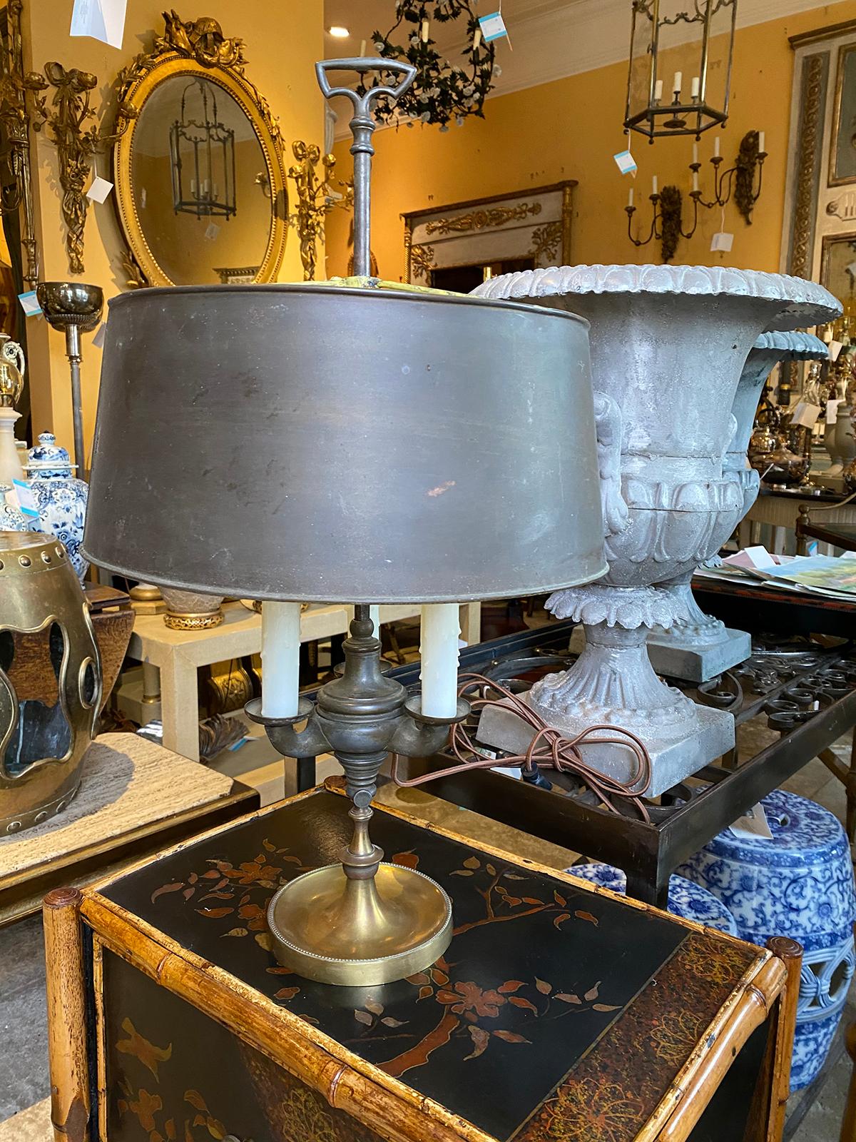 Early 20th century American bronze Bouillotte lamp with tole shade
Three arms
New wiring.