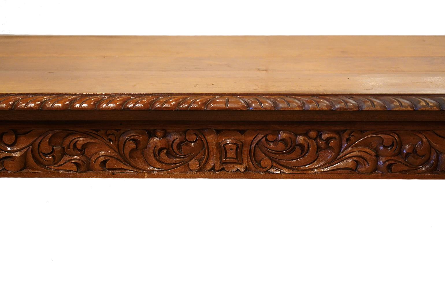 This elaborately carved Baroque style library or center table is a feast for the eyes. Well-crafted carvings cover almost all of the surfaces adding an almost sculptural effect.