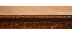 Early 20th Century American Carved Walnut Threstle Base Library or Center Table