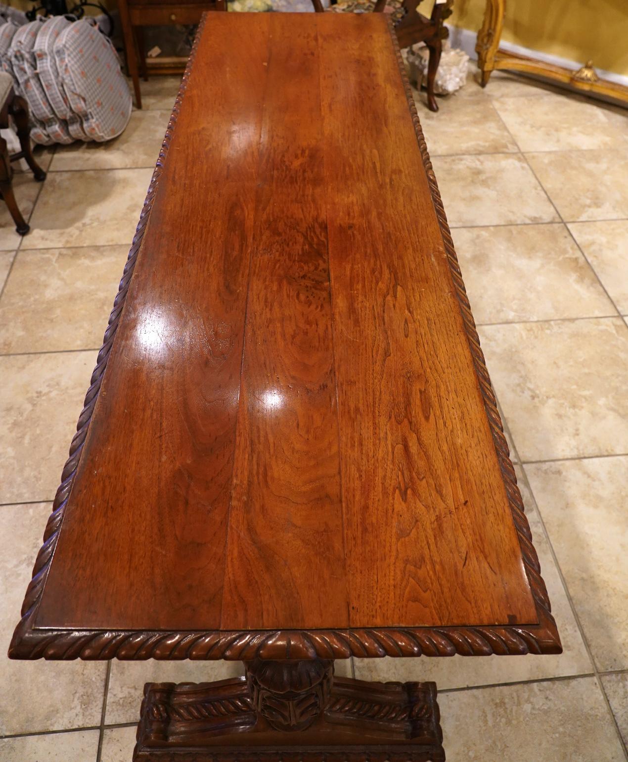 Early 20th Century American Carved Walnut Threstle Base Library or Center Table 4