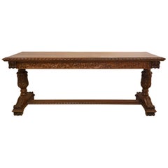 Early 20th Century American Carved Walnut Threstle Base Library or Center Table