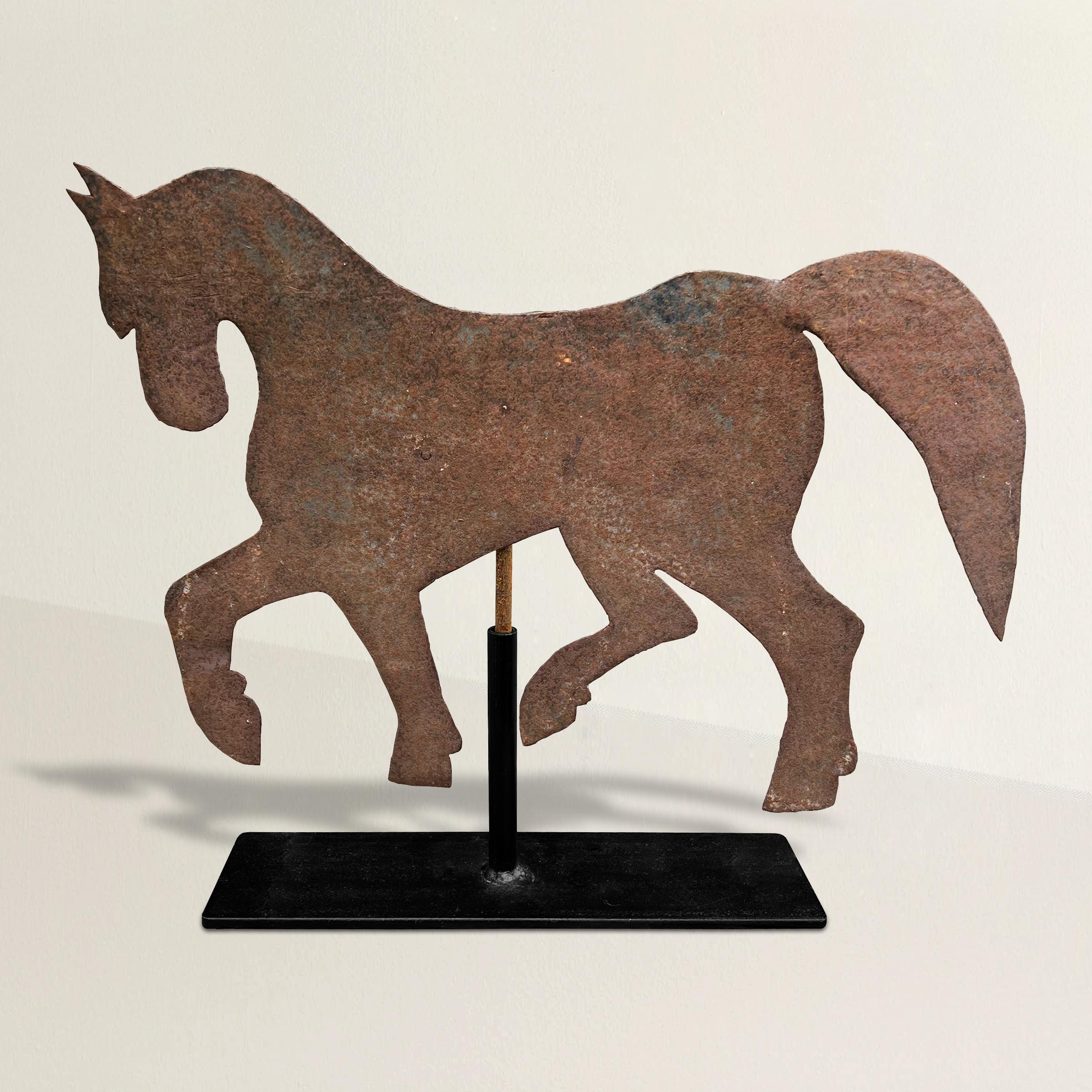 This early 20th century American folk art draught horse weathervane is a remarkable piece crafted from sheet metal, capturing the essence of traditional American folk art. The weathervane features a charming draught horse design, skillfully formed