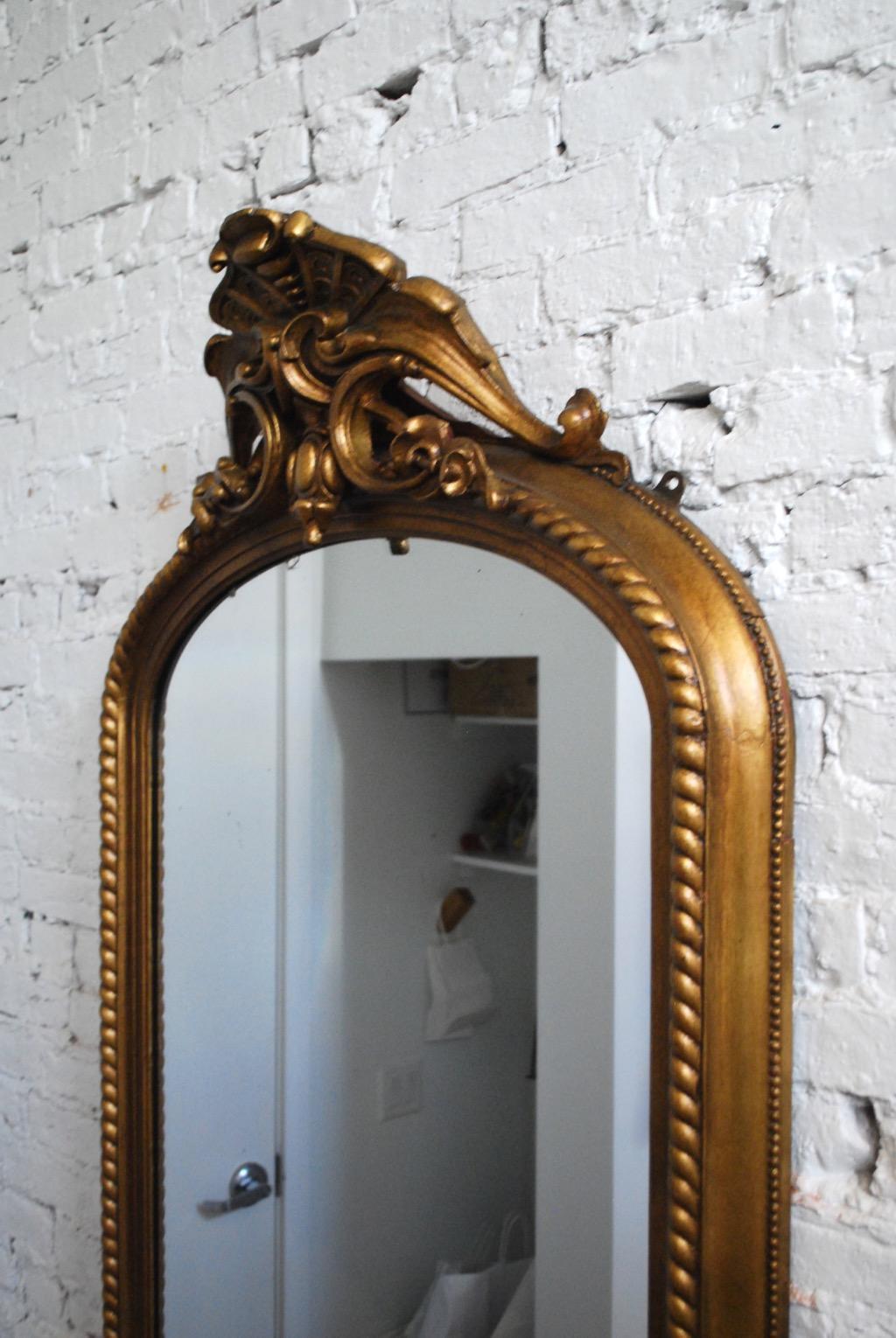 Early 20th century, American gilt resin and gesso hallway mirror 
Restored.