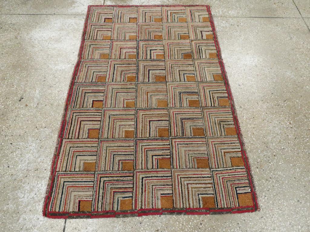 Una antigua alfombra de gancho americana hecha a mano a principios del siglo XX.

Medidas: 2' 11