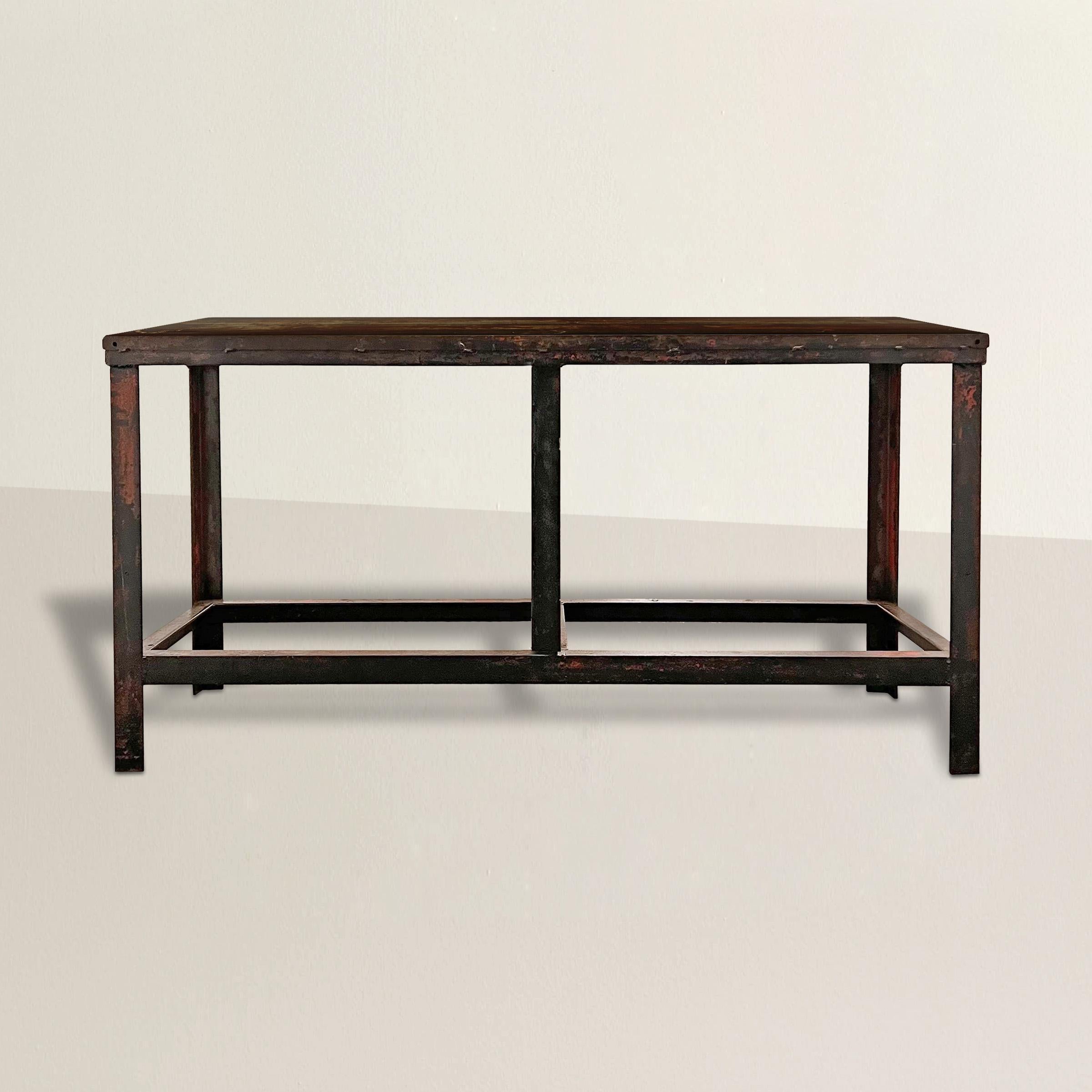 An incredible early 20th century American industrial steel console with the most wonderful patina and traces of red paint. Table is perfect as a console table, sofa table, or sideboard in your dining room.