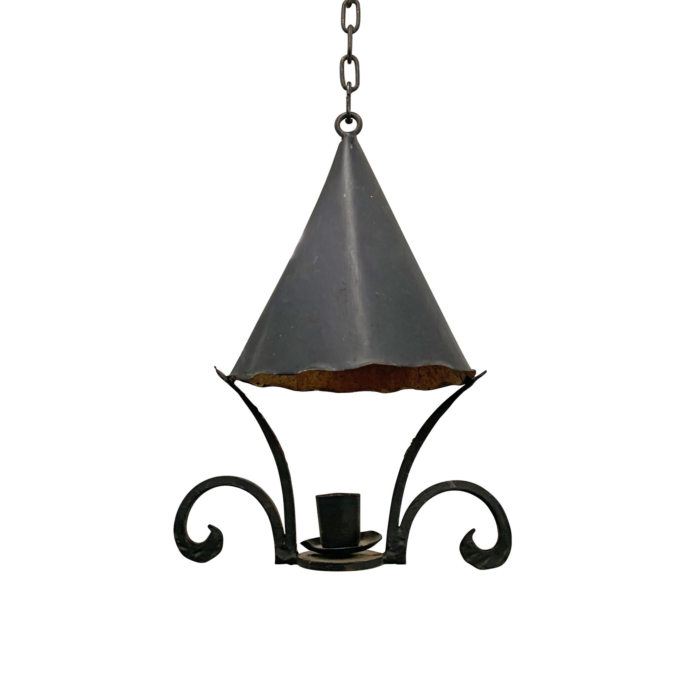 A charming early 20th century American iron light fixture with a gilt-lined cone-shaped dome suspended over a single 
