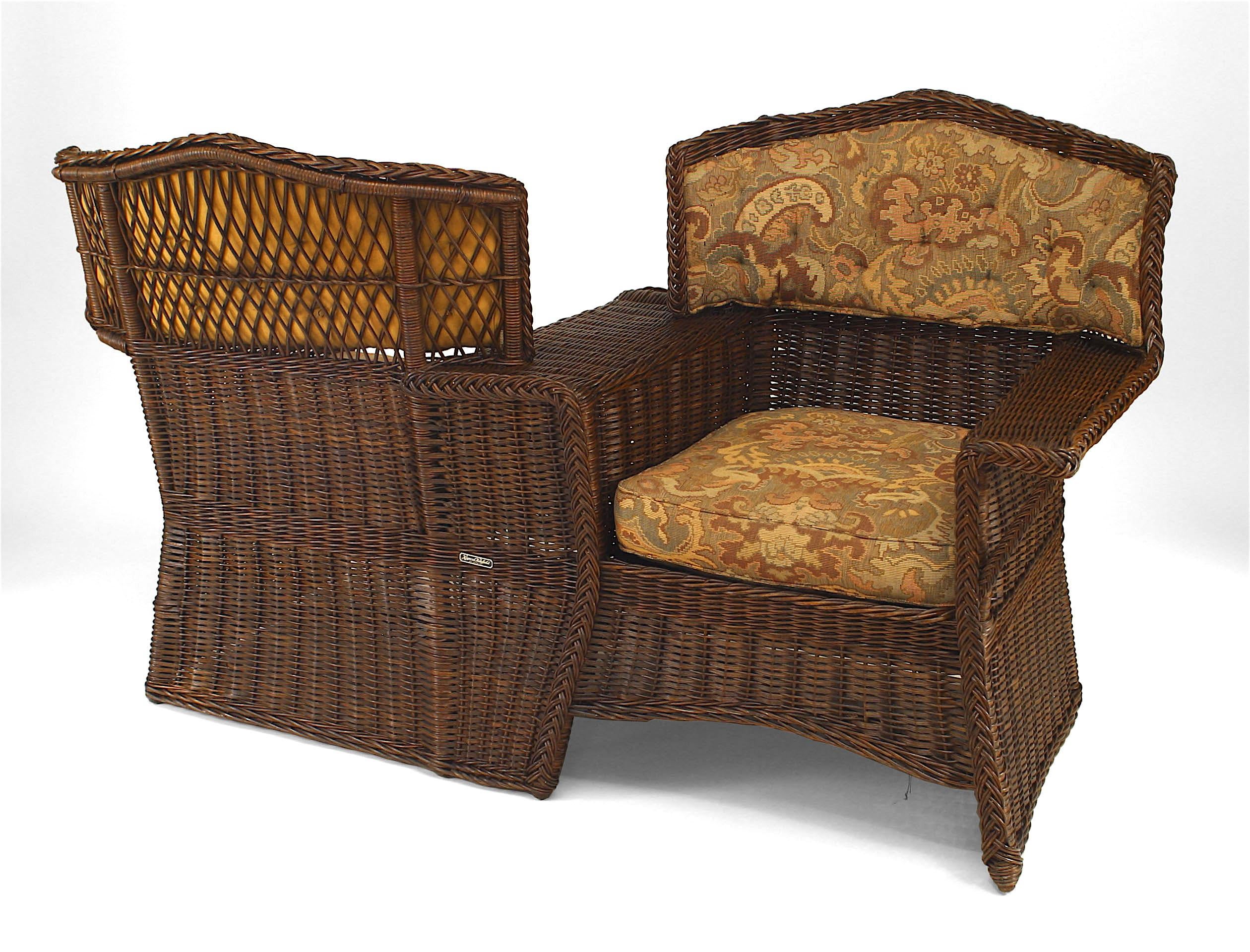 American Victorian (Mission) natural wicker tete-a-tete (conversation seat) with shaped back and tapestry upholstered seat and back. (HEYWOOD WAKEFIELD)
