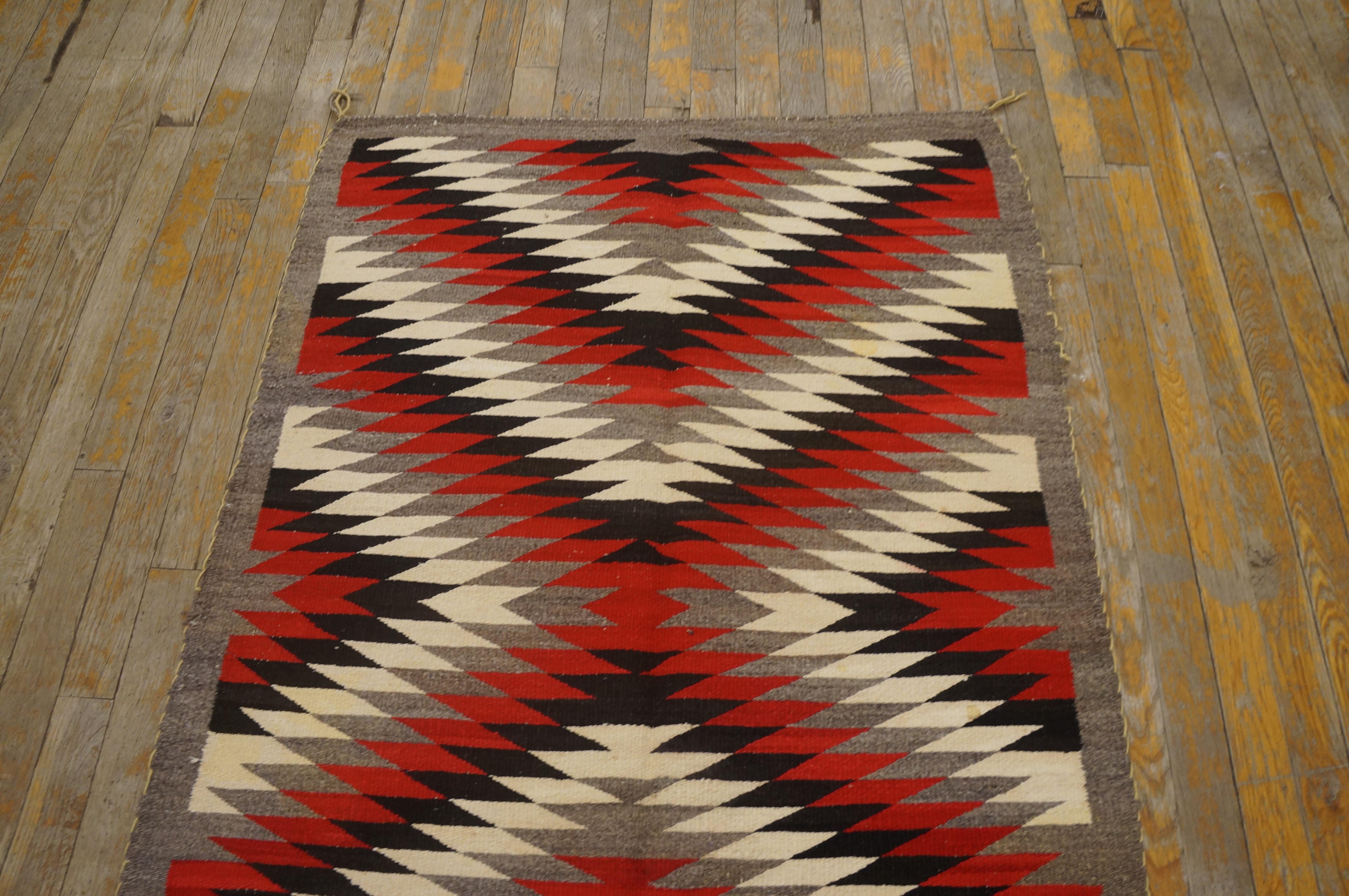 Early 20th Century American Navajo Eye Dazzler Carpet ( 3' x 4'2'' - 91 x 127 ) In Good Condition For Sale In New York, NY