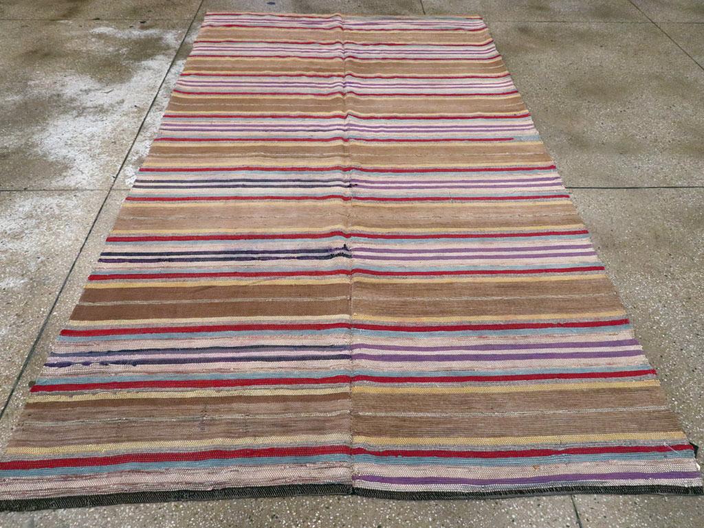 Una antigua American Rag Rug hecha a mano a principios del siglo XX.

Medidas: 5' 8