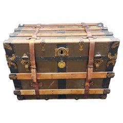 Early 20th Century American Wood and Leather Mounted Rolling Packing Trunk