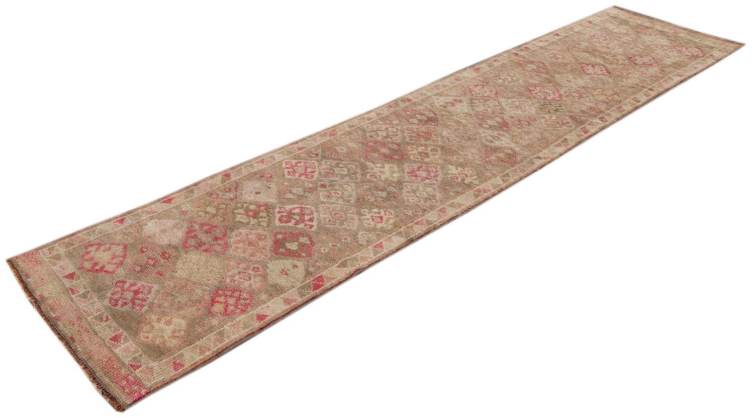 Beautiful Anatolian Village Runner rug, hand knotted with a tan field, ivory, light and bright pink accents with an all-over geometric design.

 This rug measures 2' 11