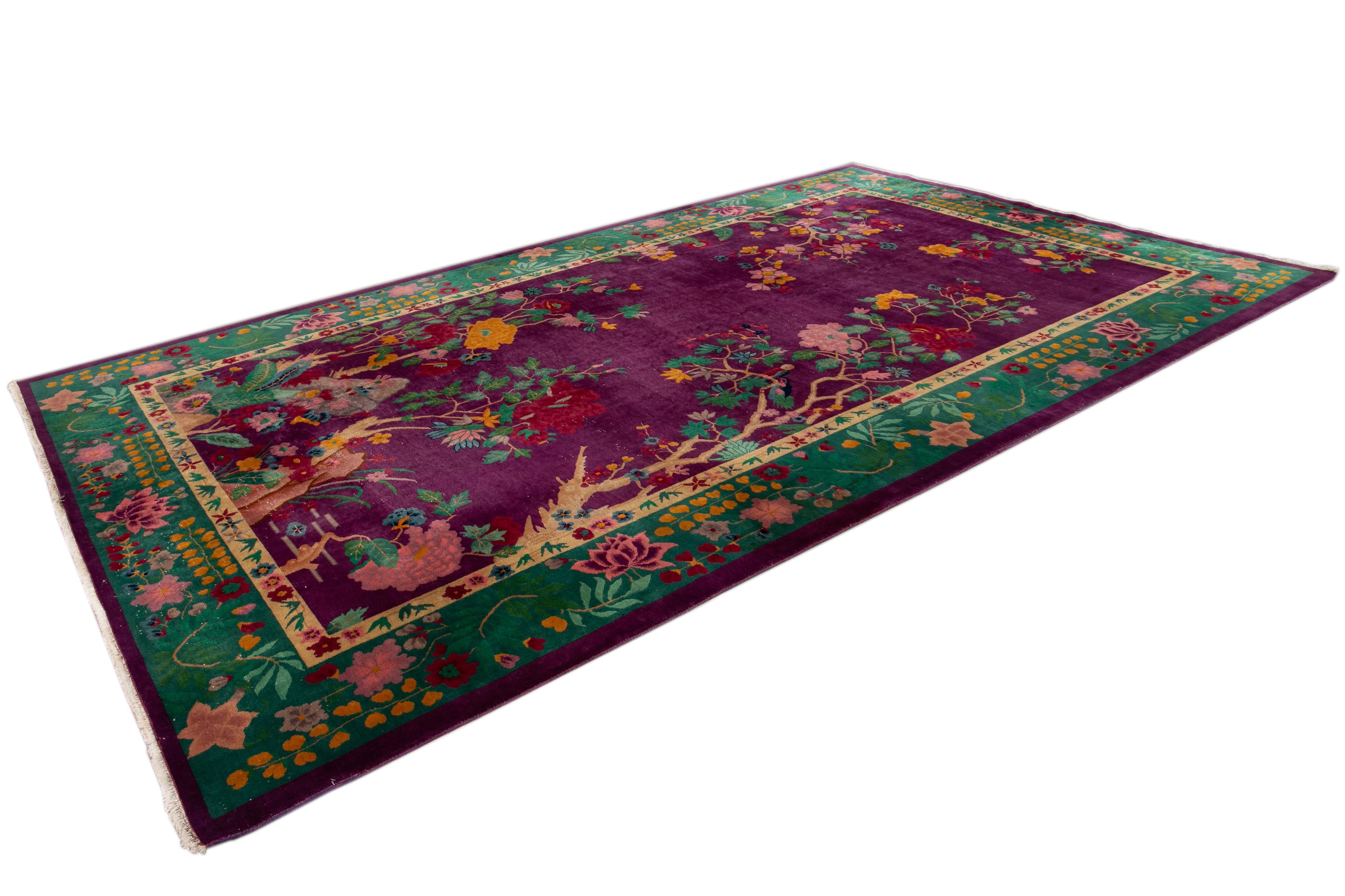 Beautiful antique Art Deco Chinese rug, with a burgundy field, green frame in an allover classic Chinese floral design.China 
This rug measures 8' 9