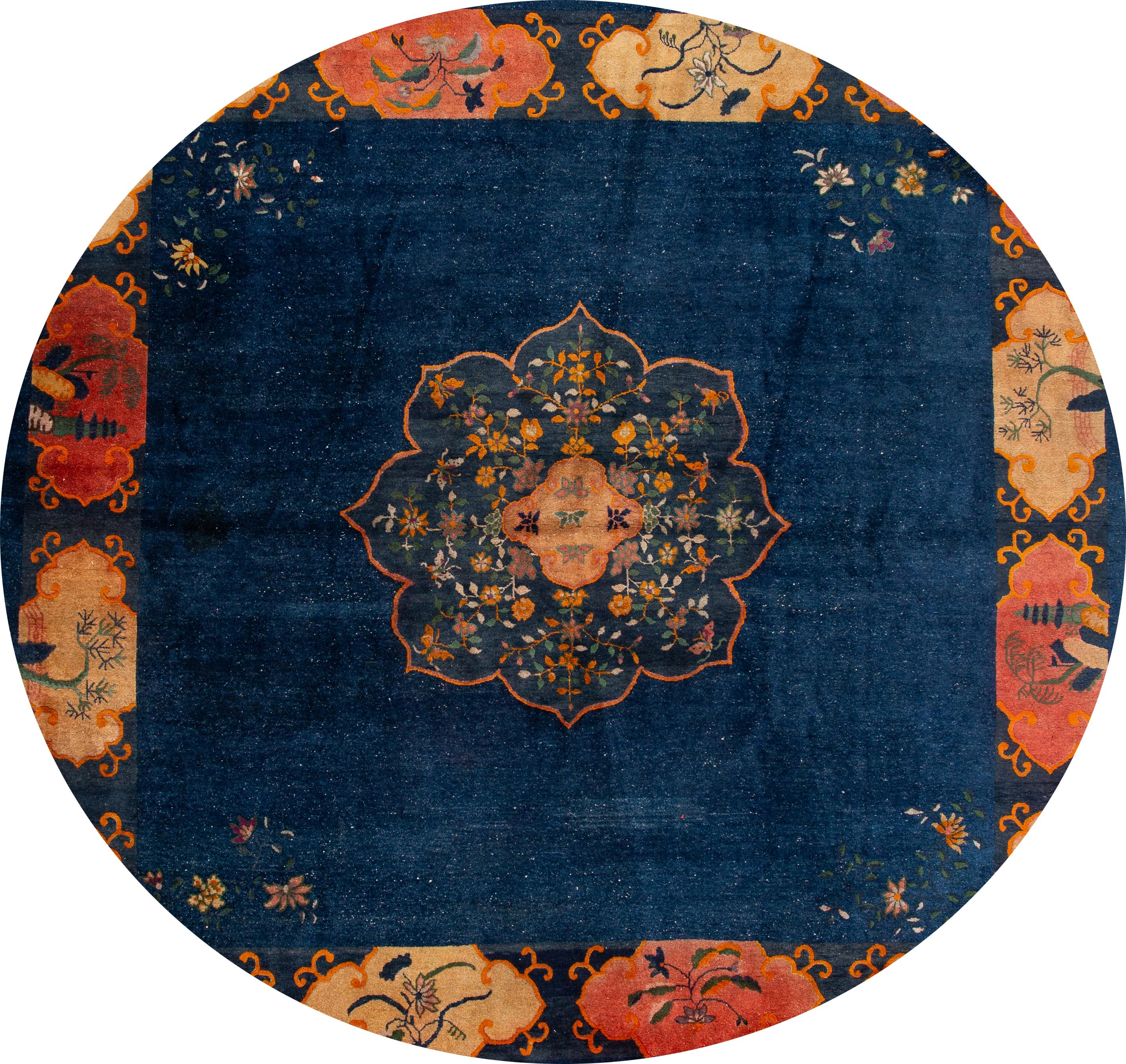 Beautiful antique Chinese Art Deco rug 13 x 12, hand knotted wool with a dark blue field, tan frame and a multi-color accents in a subtle all-over Classic Chinese floral design.
This rug measures 12'6” x 12'4”.
  