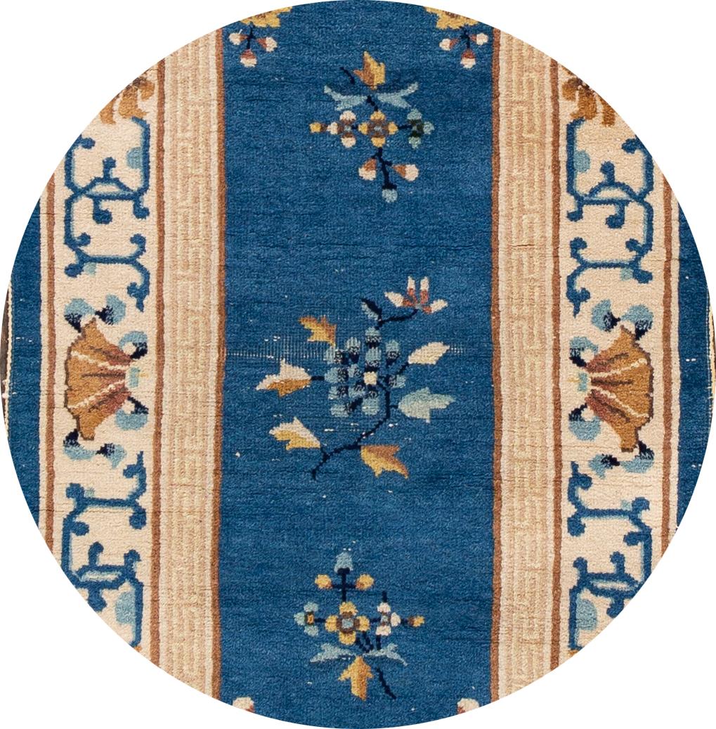 Beautiful antique Chinese Art Deco runner, hand knotted wool with a navy blue field, tan frame in a subtle all-over Classic Chinese floral design.
This rug measures: 2'6