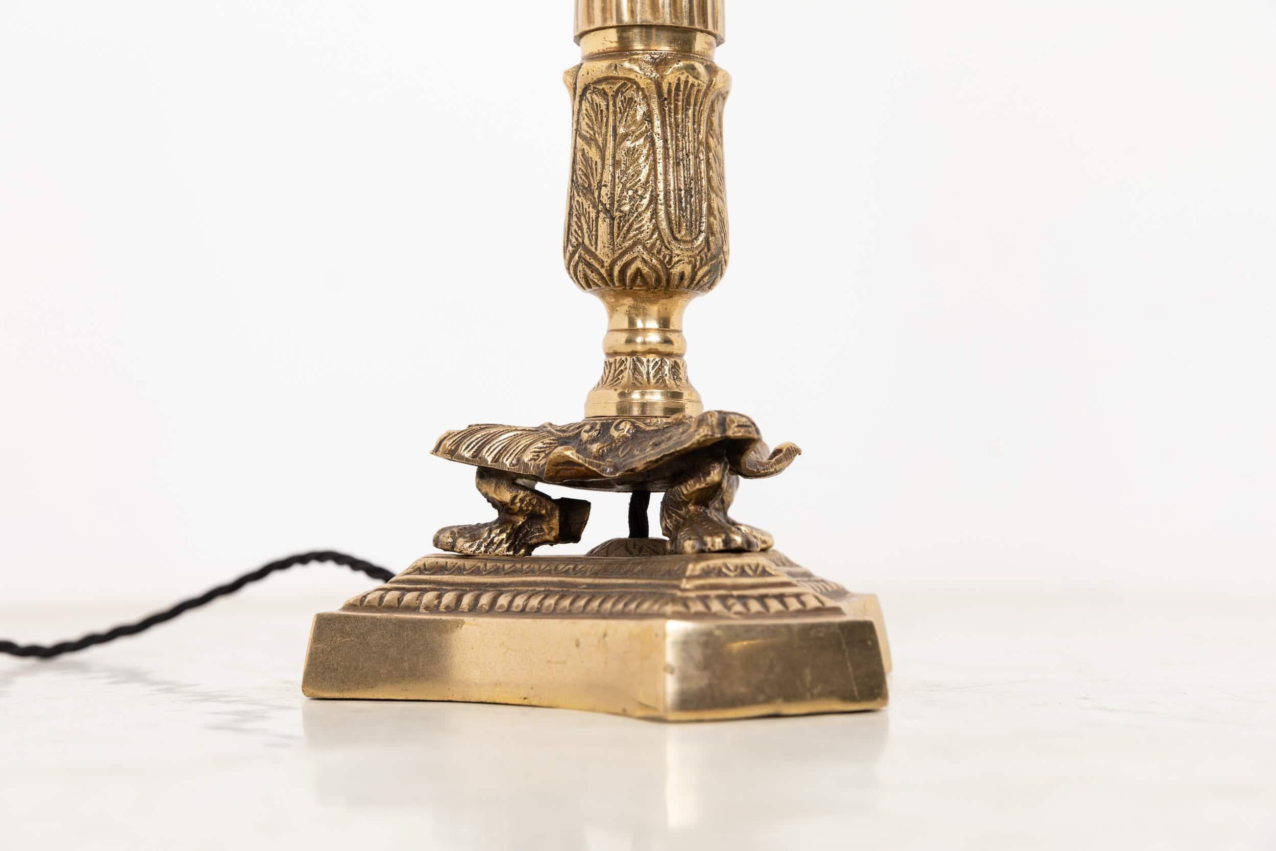 A wonderful early 20th century brass table lamp. c.1910.

Thought to have begun life as a candlestick later adapted for electric use, it showcases the refined quality of early 20th‑century design. The lamp is cast in brass with elegant Art Nouveau