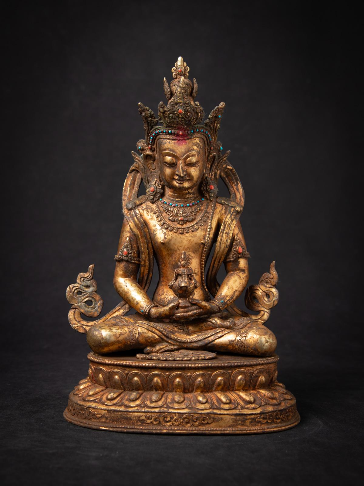 Antique bronze Nepali Aparmita Buddha statue

Material : bronze
37,4 cm high
24,4 cm wide and 19 cm deep
Fire gilded with 24 krt. gold
Dhyana mudra
Late 19th / early 20th century
Inlaid with real Gem stones
Weight: 5,68 kgs
Originating from Nepal